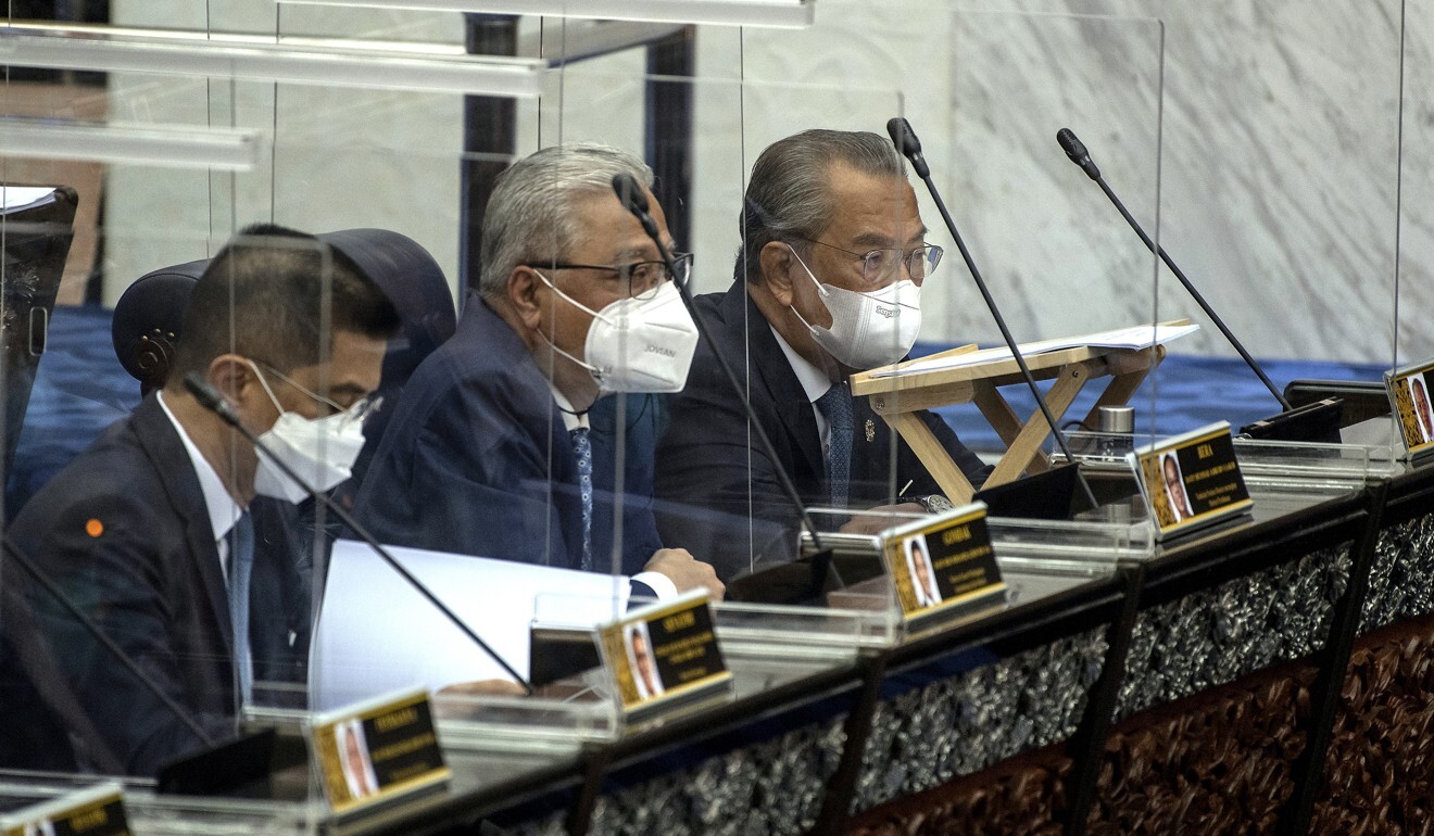 Malaysian Prime Minister Muhyiddin Yassin (right) attends a special parliamentary sitting to brief the legislature on the country’s coronavirus recovery plan. Photo: DPA