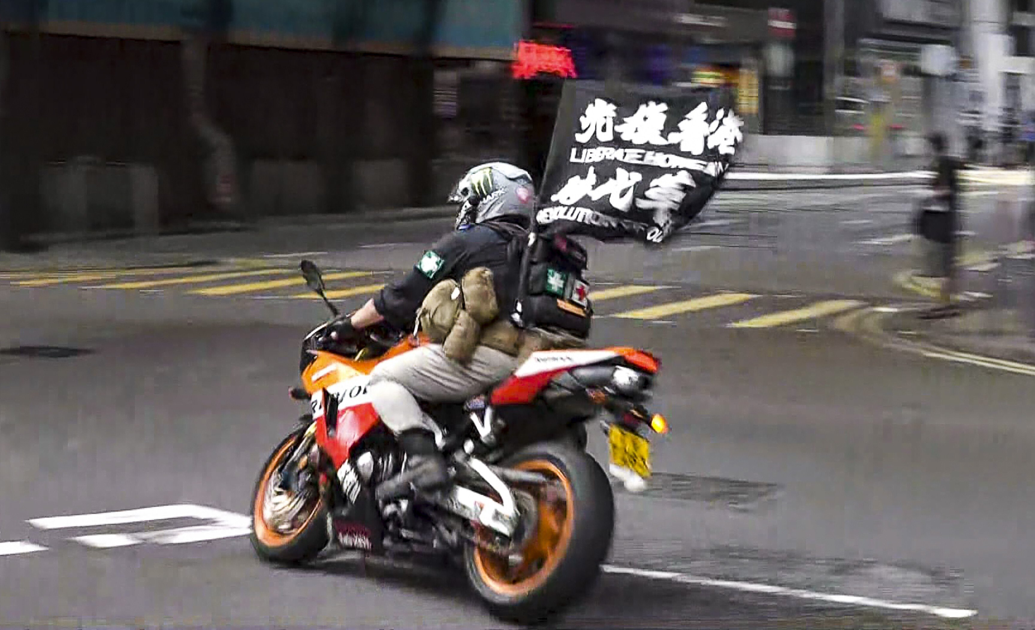 Leon Tong rode his motorcycle into police officers during a July 1 rally last year. Photo: NowTV News