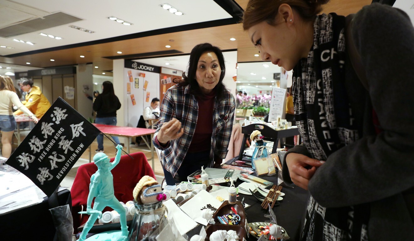 A Lunar New Year market early last year booth sells trinkets containing popular protest slogans. Photo: Xiaomei Chen