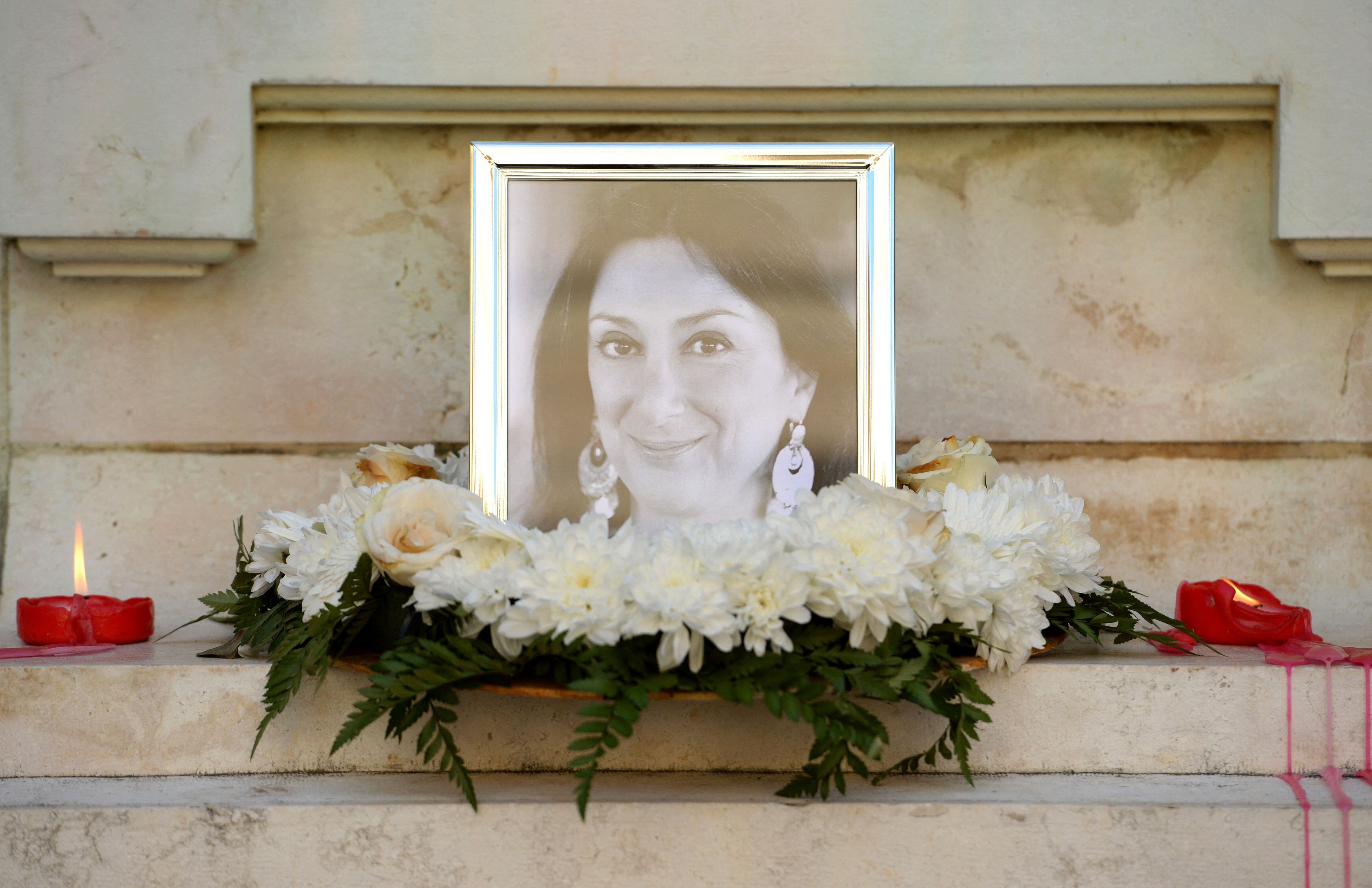 Flowers and tributes lie at the foot of the Great Siege monument in Valletta, which was turned into a temporary shrine for Maltese journalist Daphne Caruana Galizia after she was killed by a car bomb in October 2017. Photo: AFP