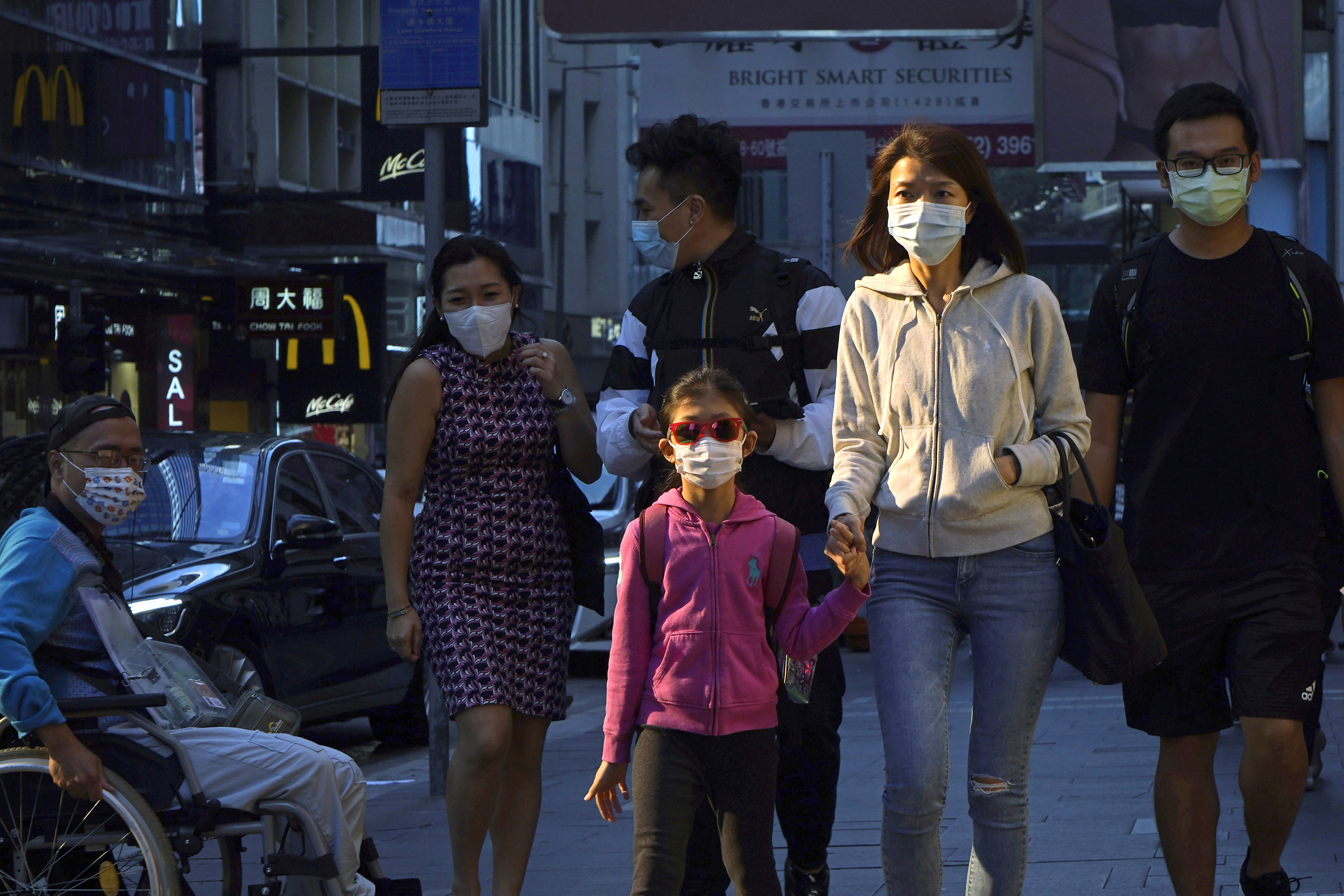 People pictured wearing face masks in Hong Kong last year. Photo: AP