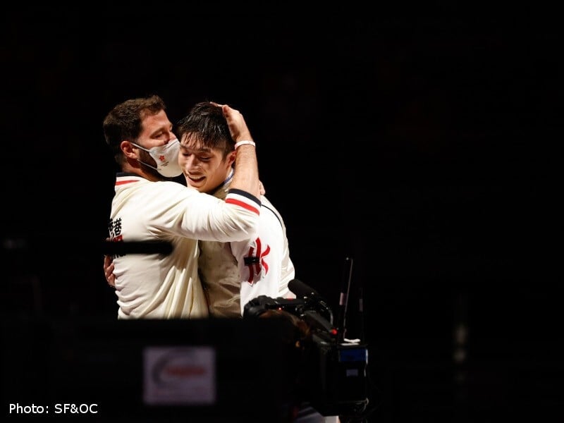 Coach Greg Koenig hugs Cheung Ka-long after the fencer’s heroics in the men’s individual foil in Tokyo Photo: Hong Kong Olympic Committee