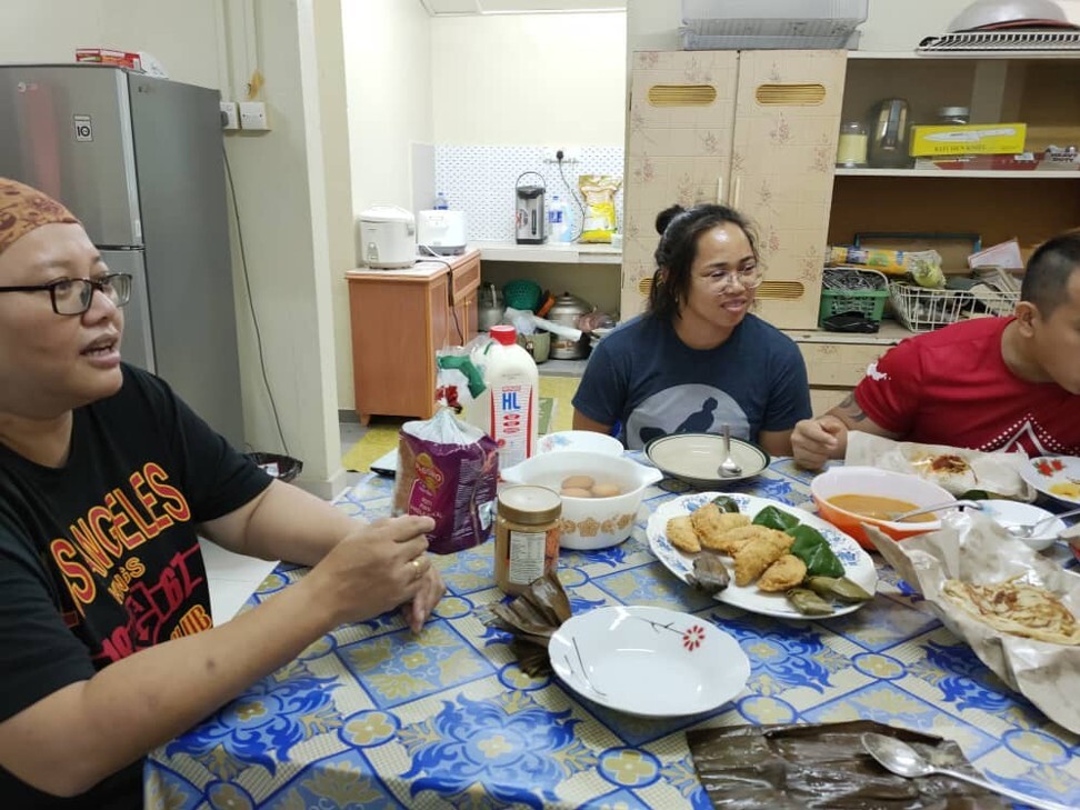 Hidilyn Diaz enjoys breakfast with her kampong family in Jasin, Melaka, Malaysia. Photo: Handout