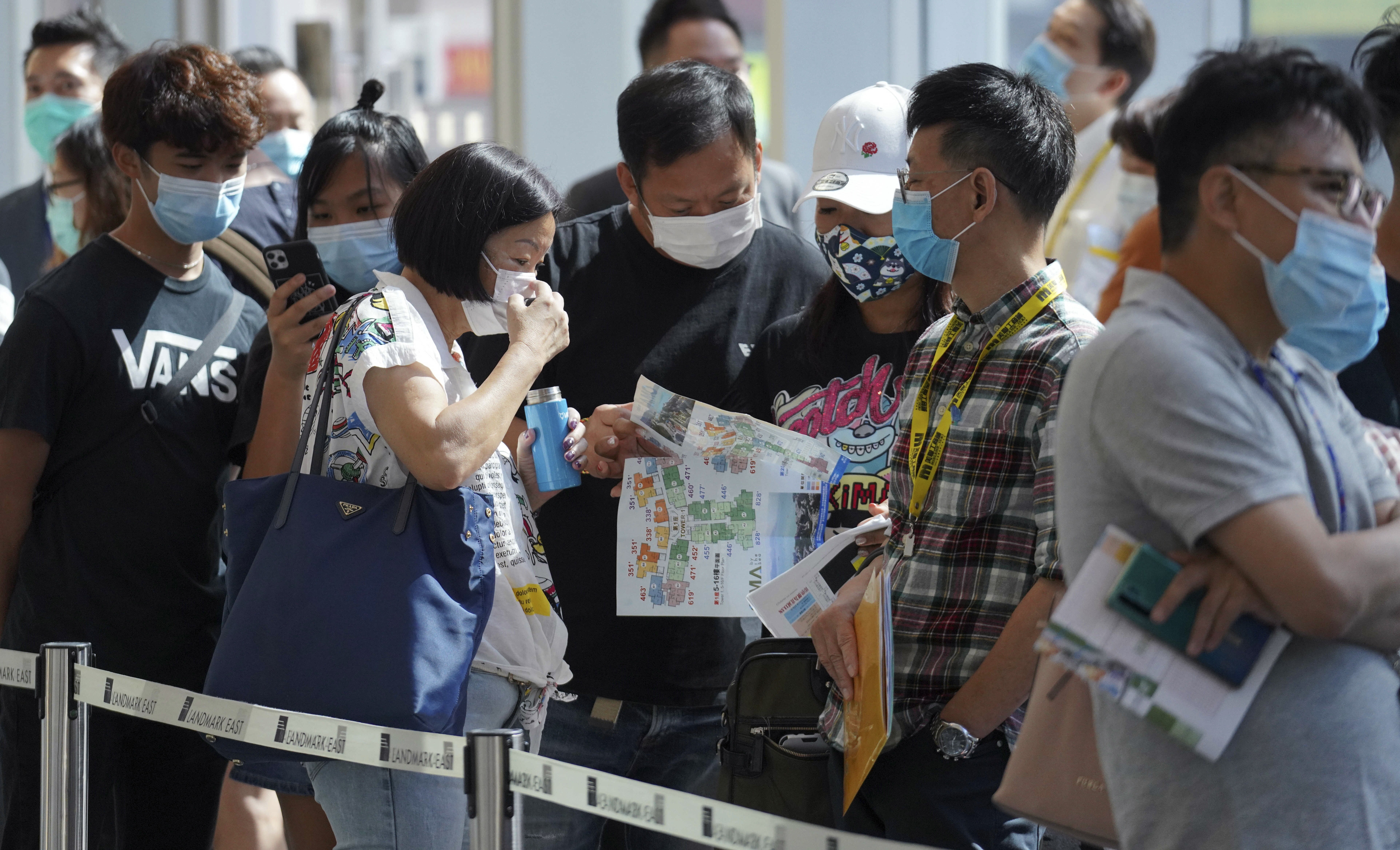 Potential buyers queue up to buy flats at Wing Tai Properties’ OMA by the Sea project in Tuen Mun, in May 2020. Photo: Winson Wong