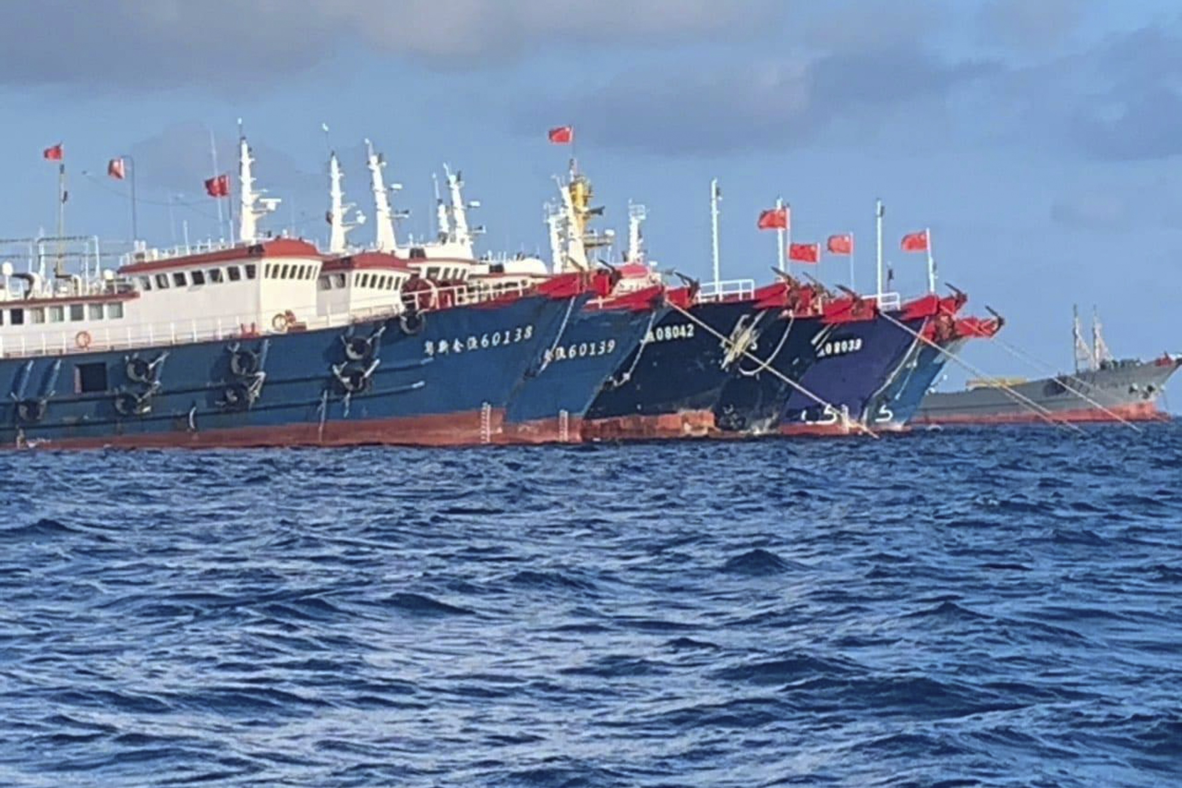 Chinese vessels moored at Whitsun Reef in March. Photo: AP