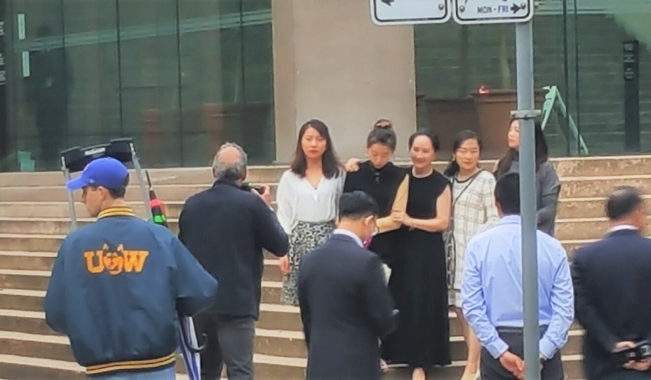 Meng Wanzhou (centre in sleeveless dress) poses for photos with supporters on the steps of the Supreme Court of British Columbia on May 23, 2020. Photo: SCMP Picture