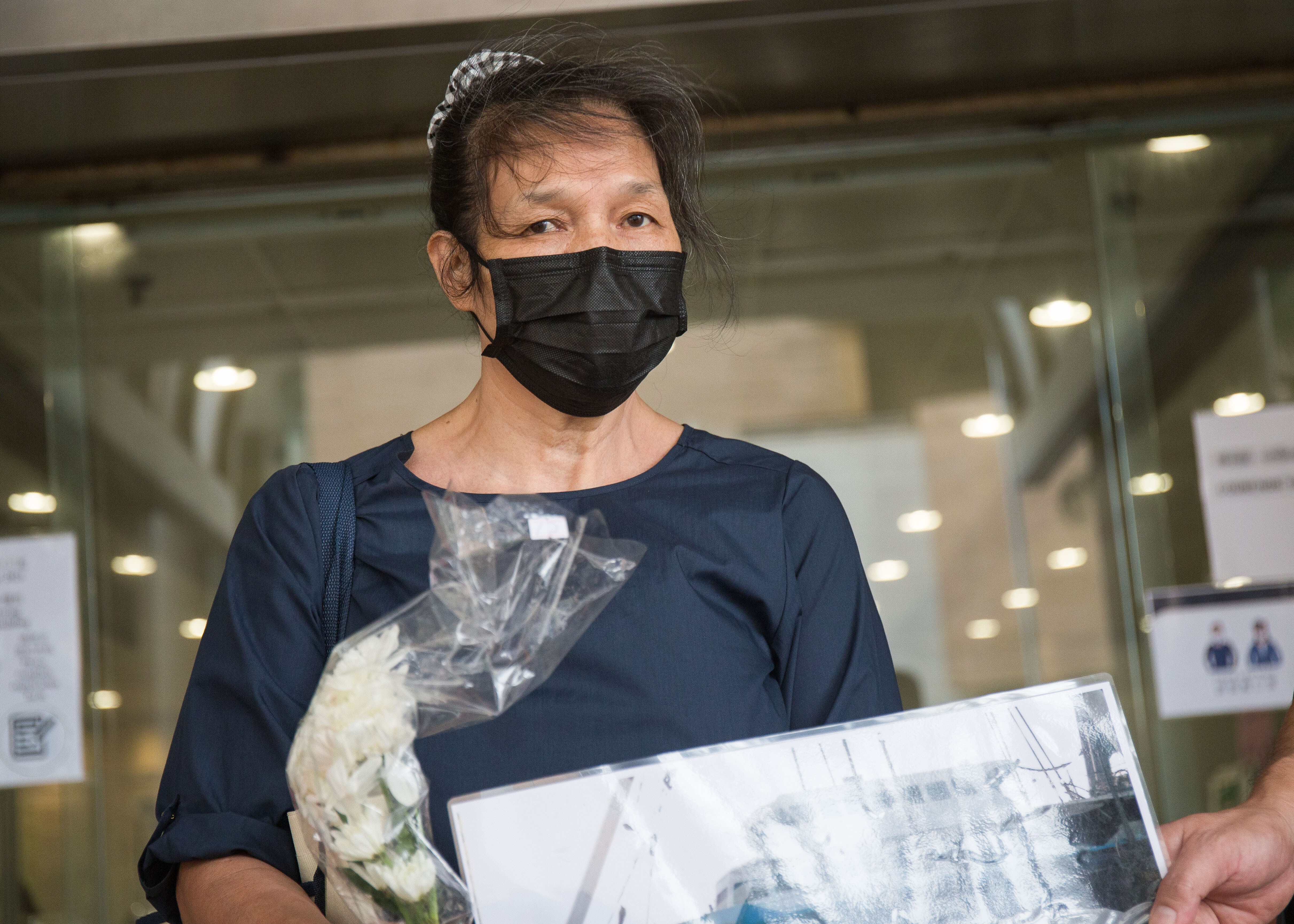 Activist Lui Yuk-lin appears outside Eastern Court, where she was fined HK$5,000 for a mask violation on Wednesday. Photo: Brian Wong