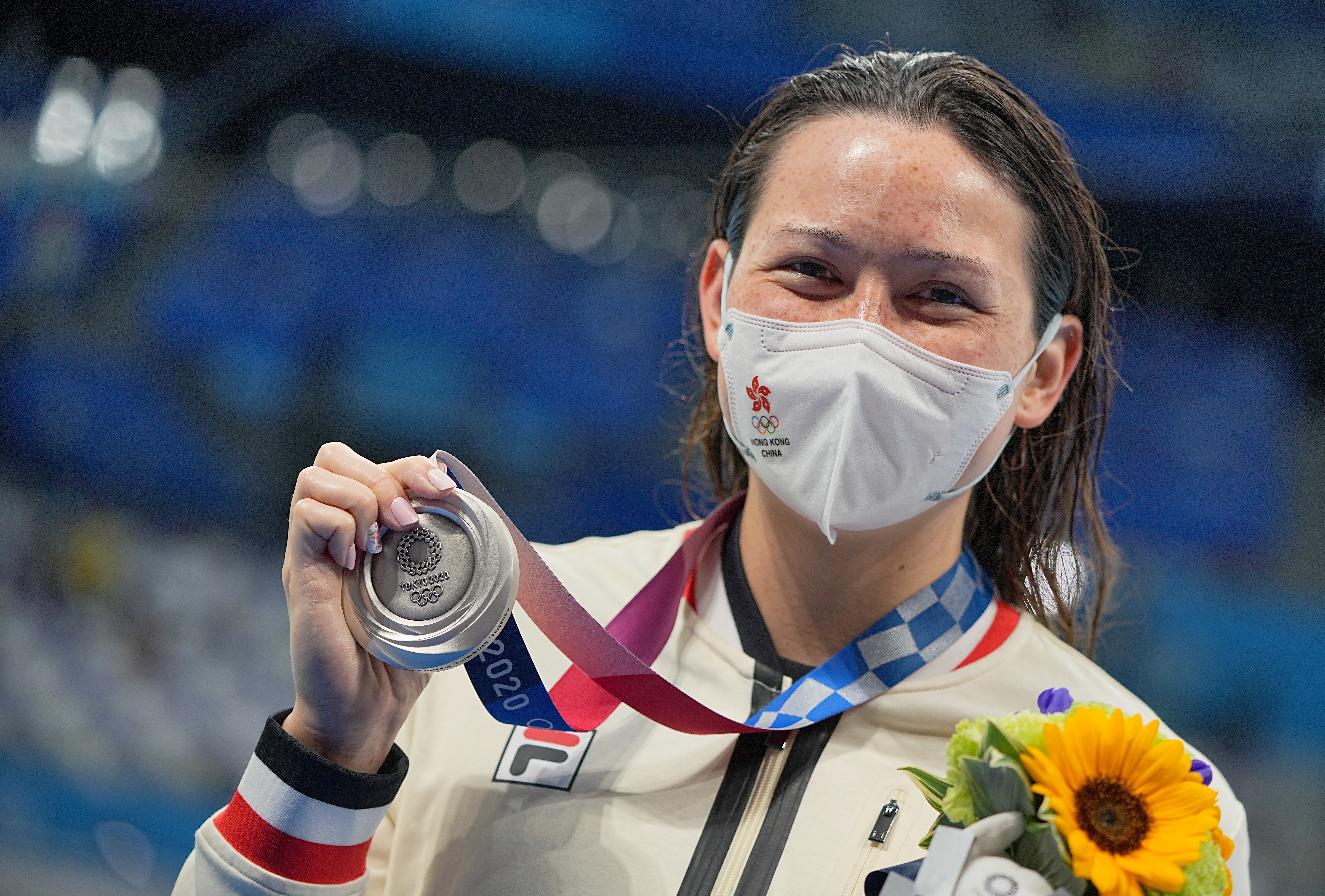Siobhan Haughey holds up her silver medal at the awards ceremony after the Women's 200m Freestyle Final at the Tokyo 2020 Olympic Games. Photo: DPA