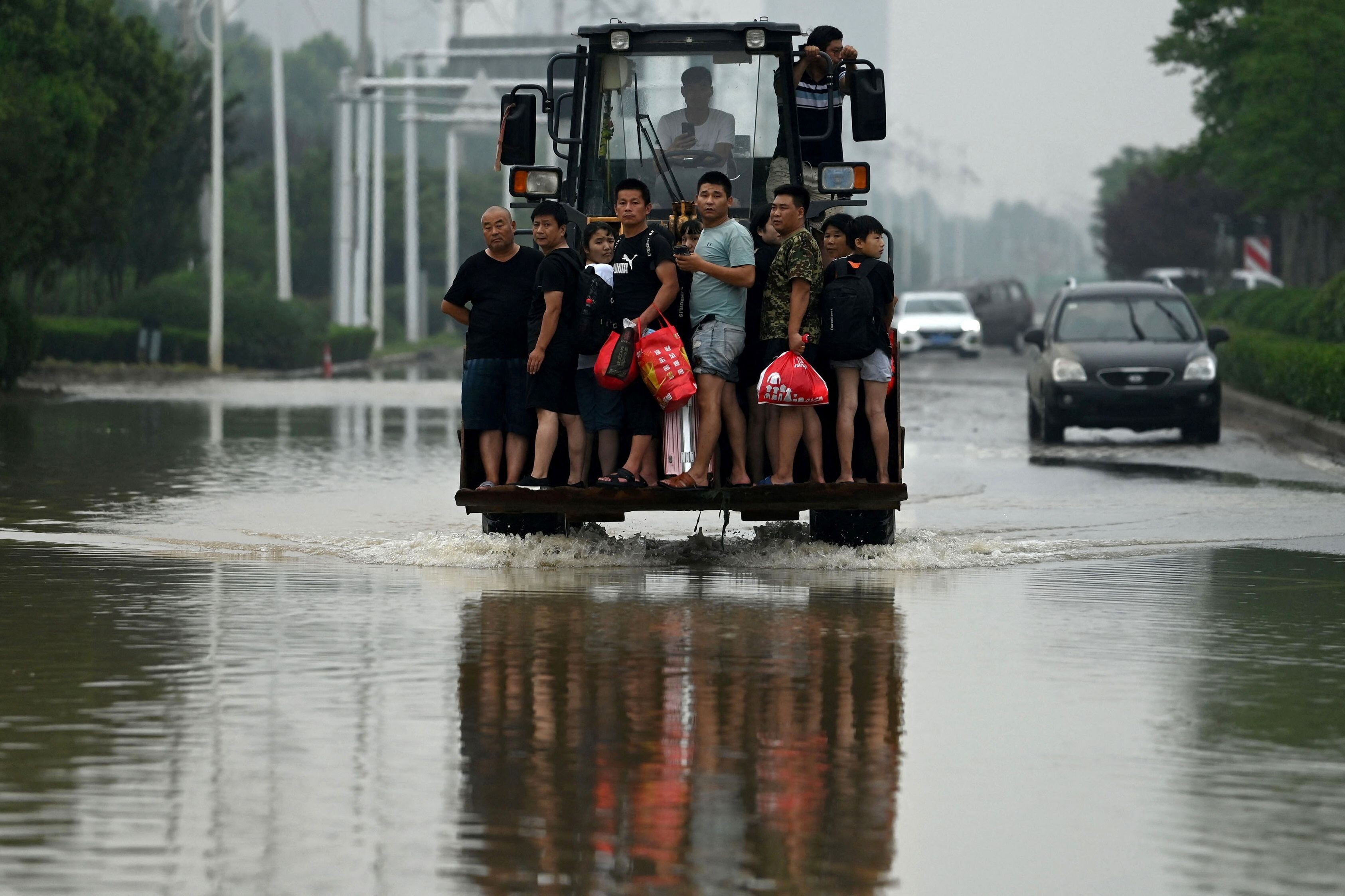 Last month’s flooding around China’s central Henan province has swept away the crops and animals of some farmers while others are seeking donations of disinfectants to stop the spread of animal disease. Photo: AFP