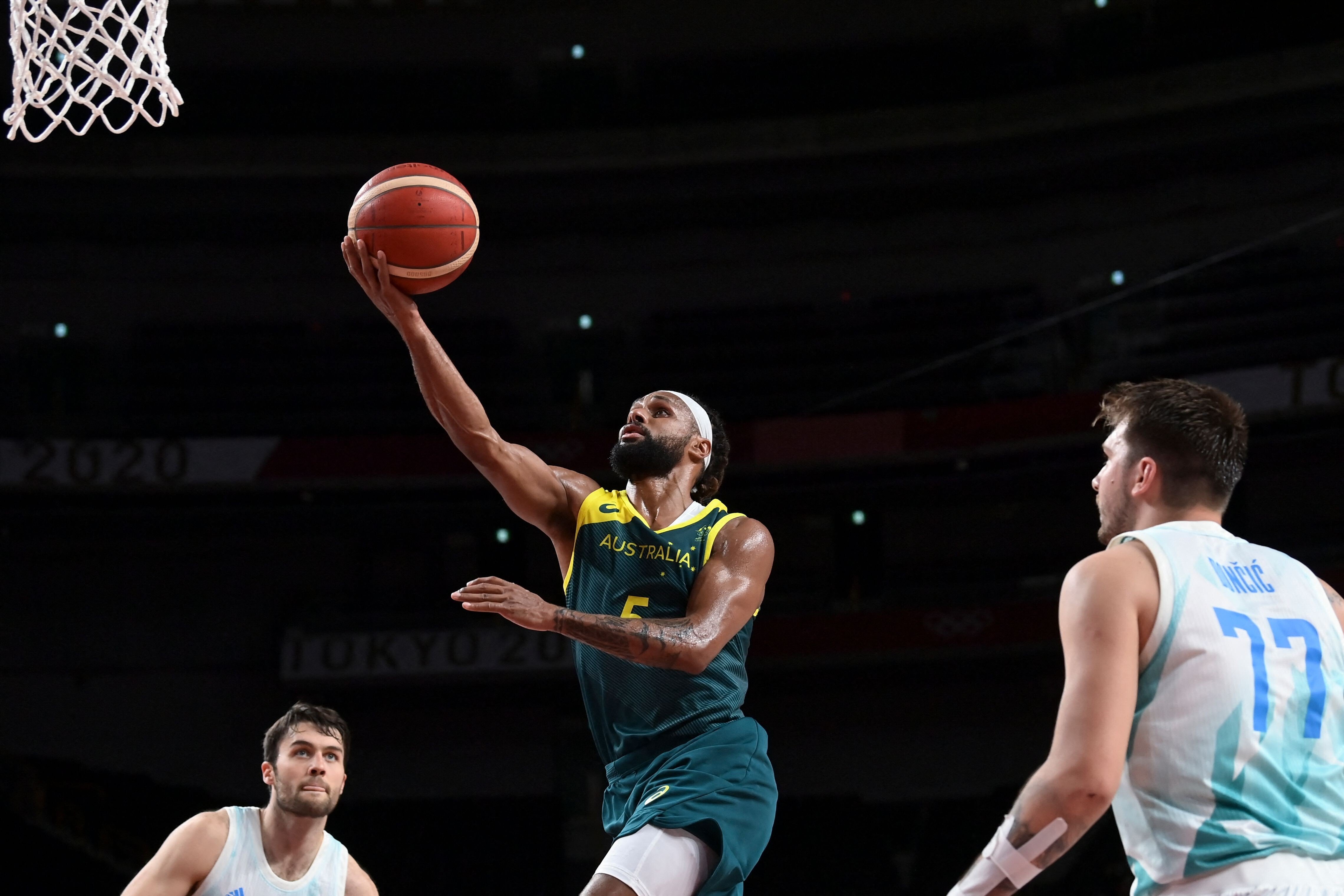 Australia’s Patty Mills goes to the basket past Slovenia’s Luka Doncic during their bronze medal match at the Tokyo 2020 Olympics. Photo: AFP