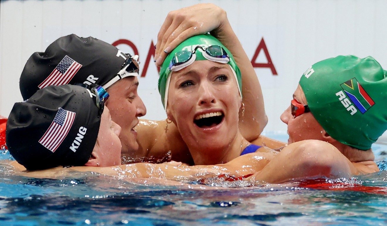 South Africa’s Tatjana Schoenmaker is congratulated by rivals after winning the women’s 200m breaststroke in world record time. Photo: Reuters