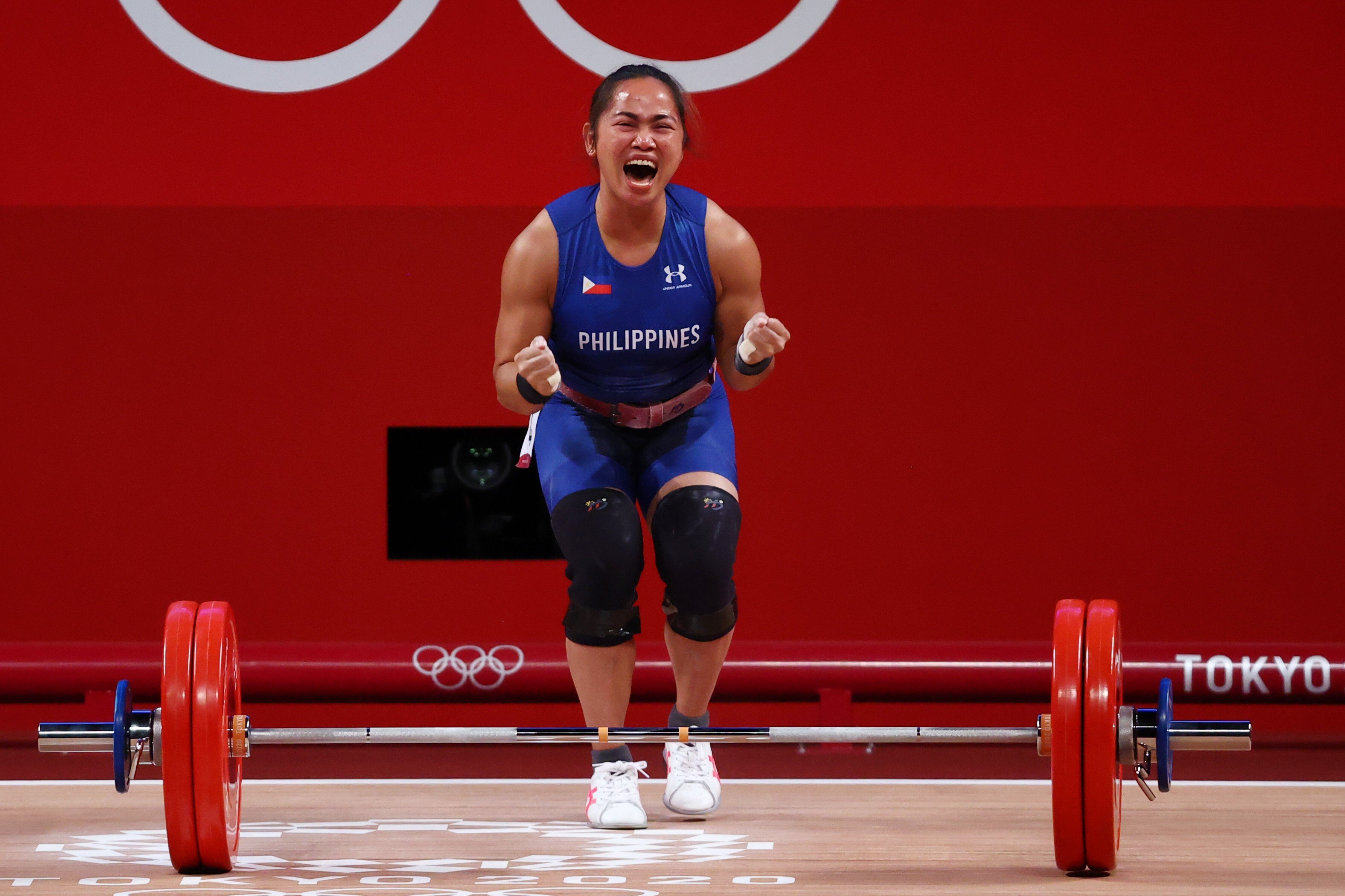 Philippines weightlifter Hidilyn Diaz celebrates soon after making the lift that earned her the 55kg gold medal. Photo: Reuters
