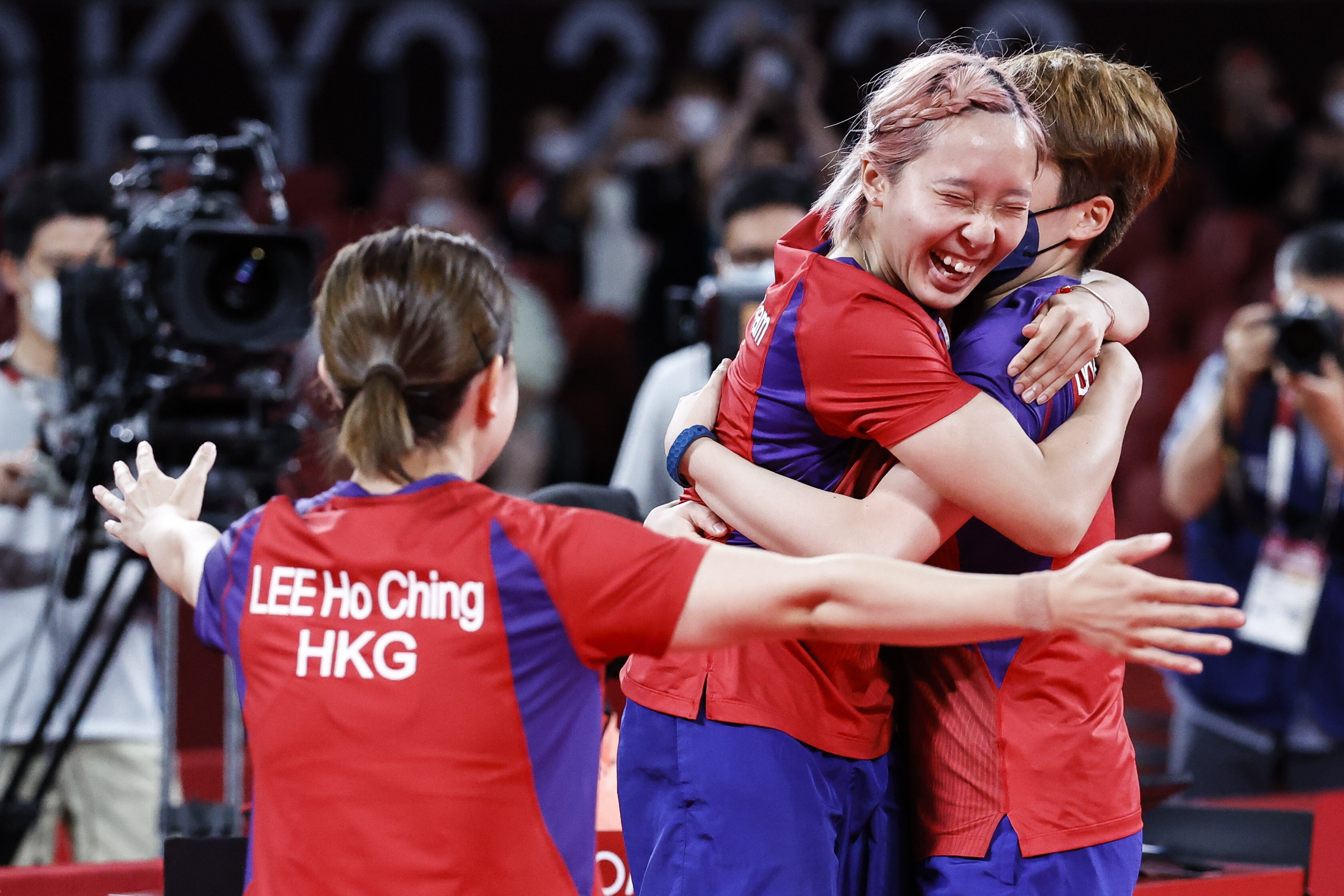Hong Kong’s Lee Ho-ching, Minnie Soo Wai-yam and Doo Hoi-kem celebrate after winning the table tennis women's team bronze medal match against Germany at the Tokyo Olympics. Photo: EPA-EFE