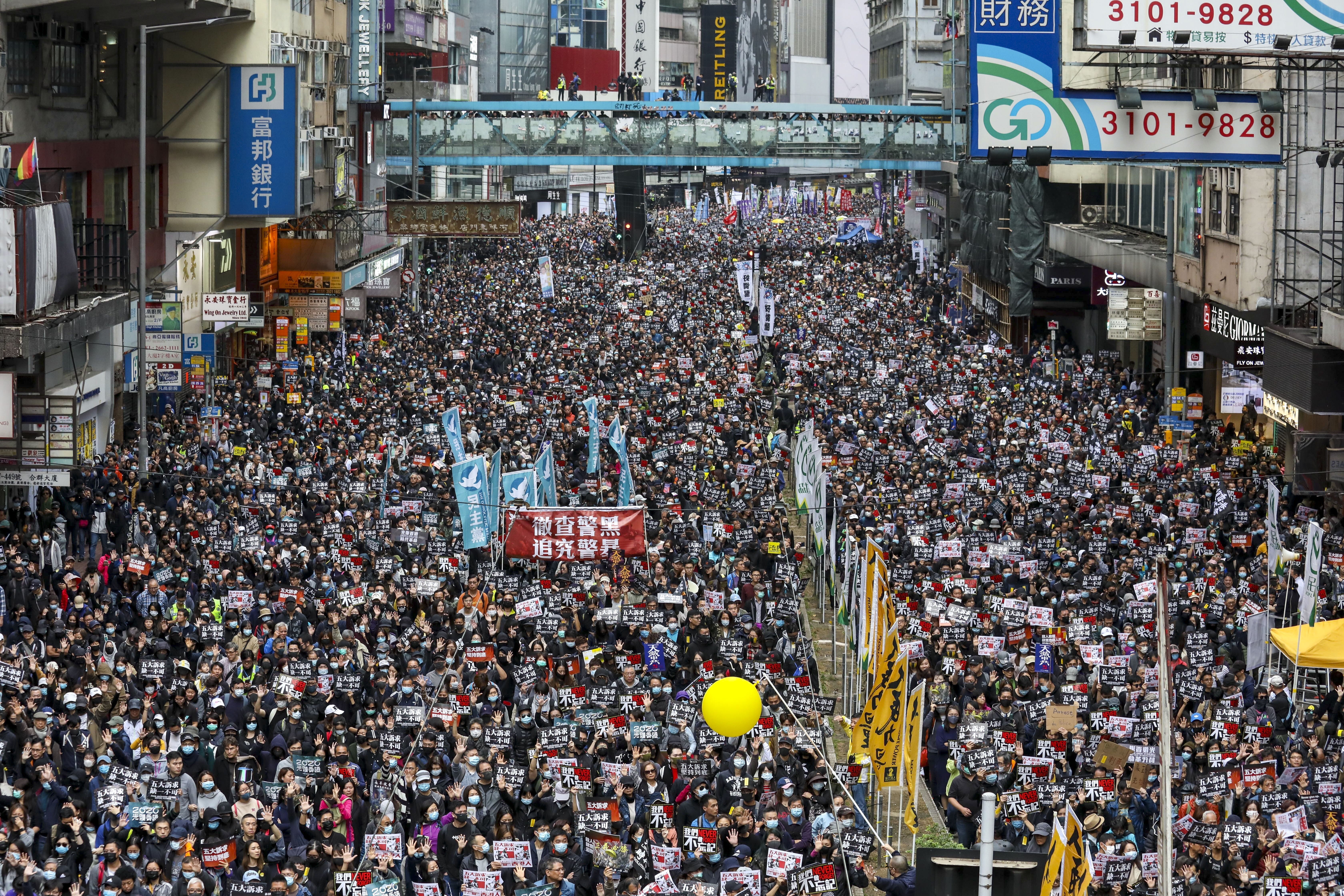 Anti-government protesters gather for a New Year’s Day march organised by the Civil Human Rights Front. Photo: Nora Tam