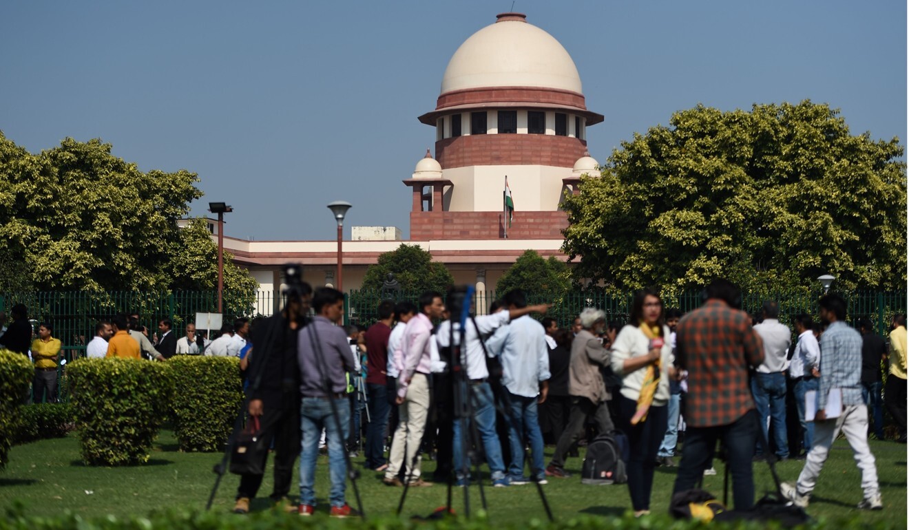 Members of the media gather at the Supreme Court in New Delhi, India. Photo: AFP