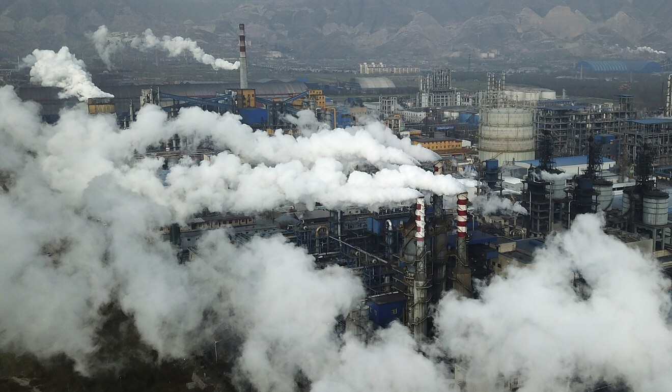 Smoke and steam rise from a coal-fired power plant in Hejin, Shanxi province. Photo: AP Photo