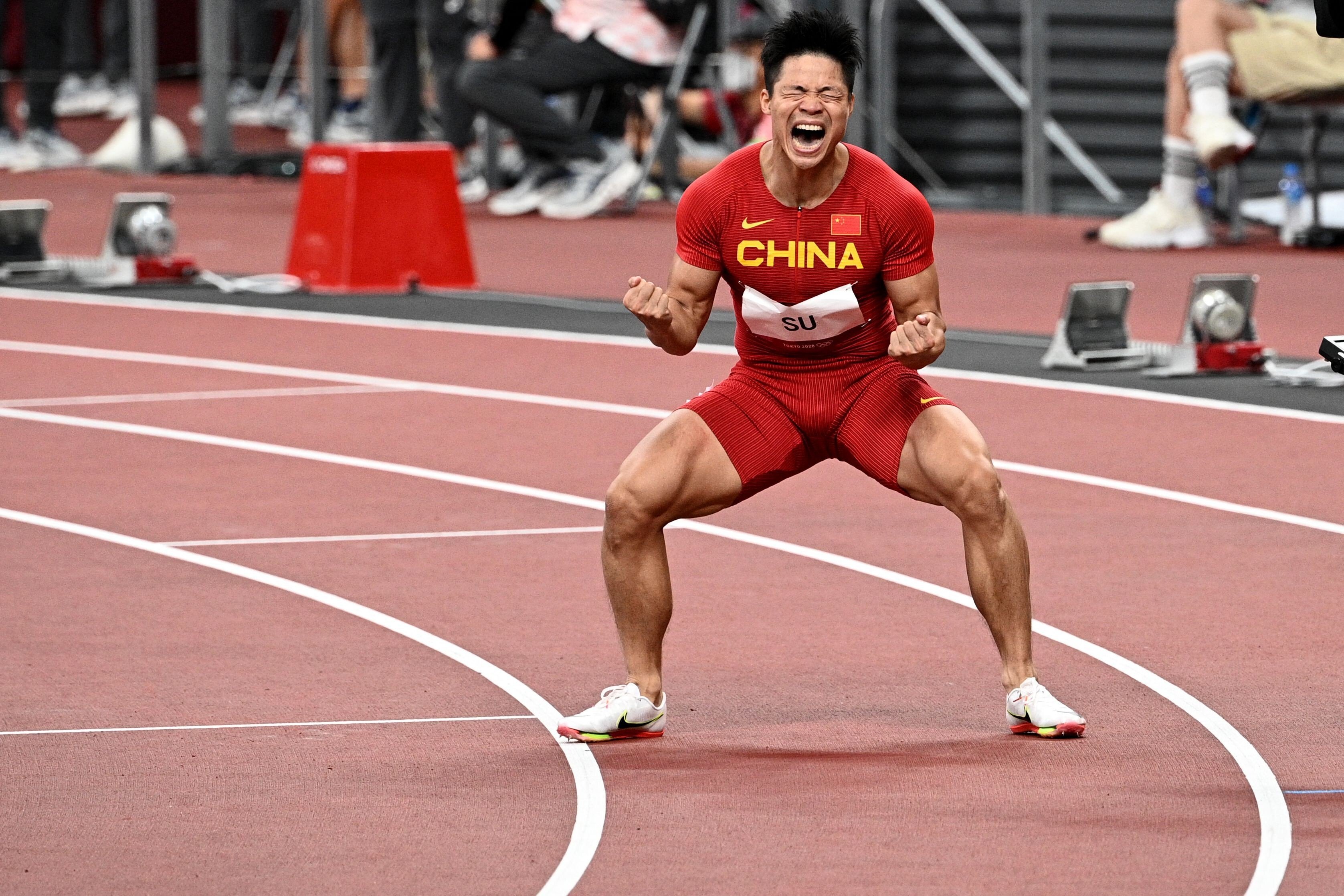 China's Su Bingtian celebrates after winning his men's 100m semi-final at the Tokyo 2020 Olympic Games. Photo: AFP