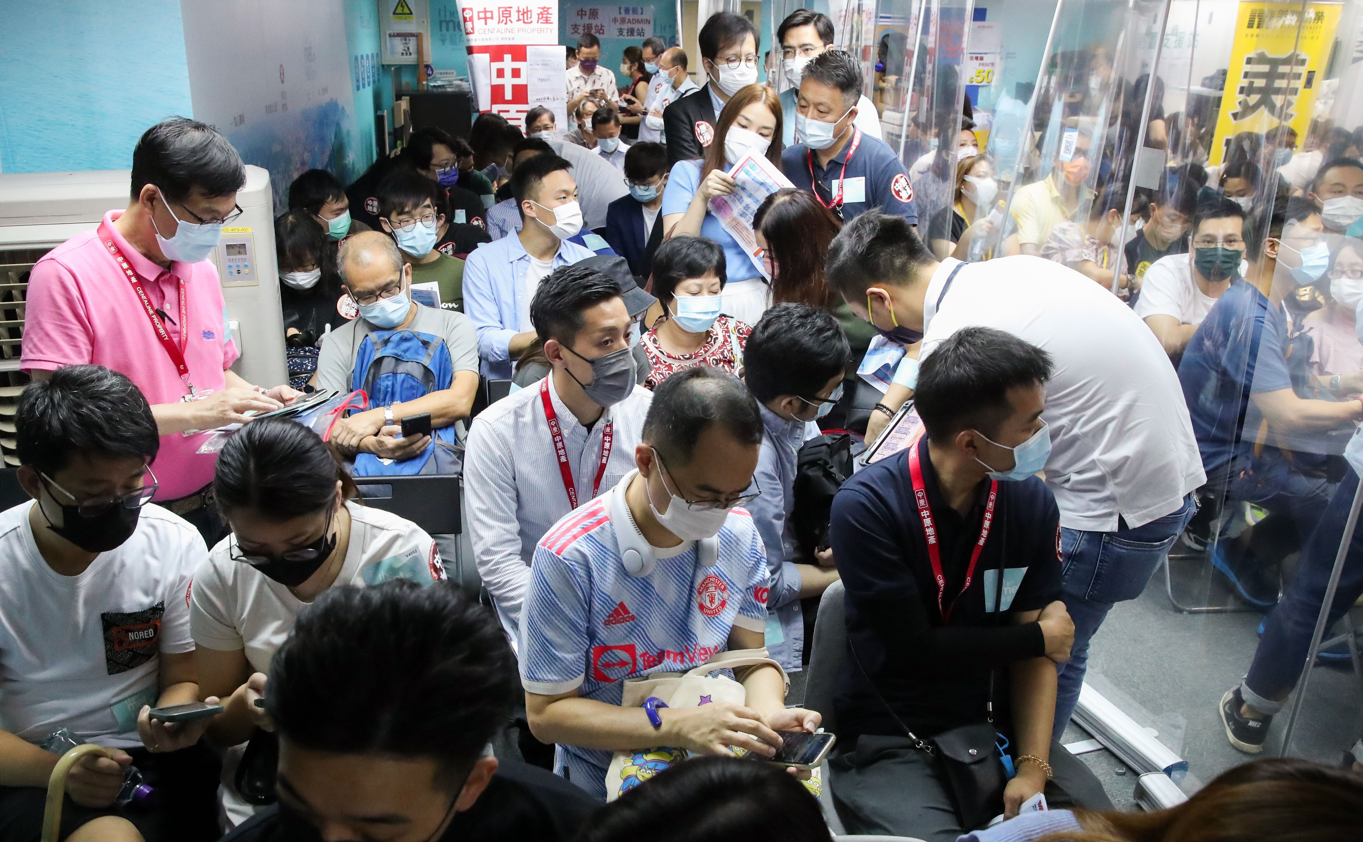 Buyers queuing up at the sales office of Wang On Properties in Mong Kok to bid for The Met.Azure development in Tsing Yi on August 14, 2021. As many as 13 buyers vied for each available unit. Photo: Edmond So
