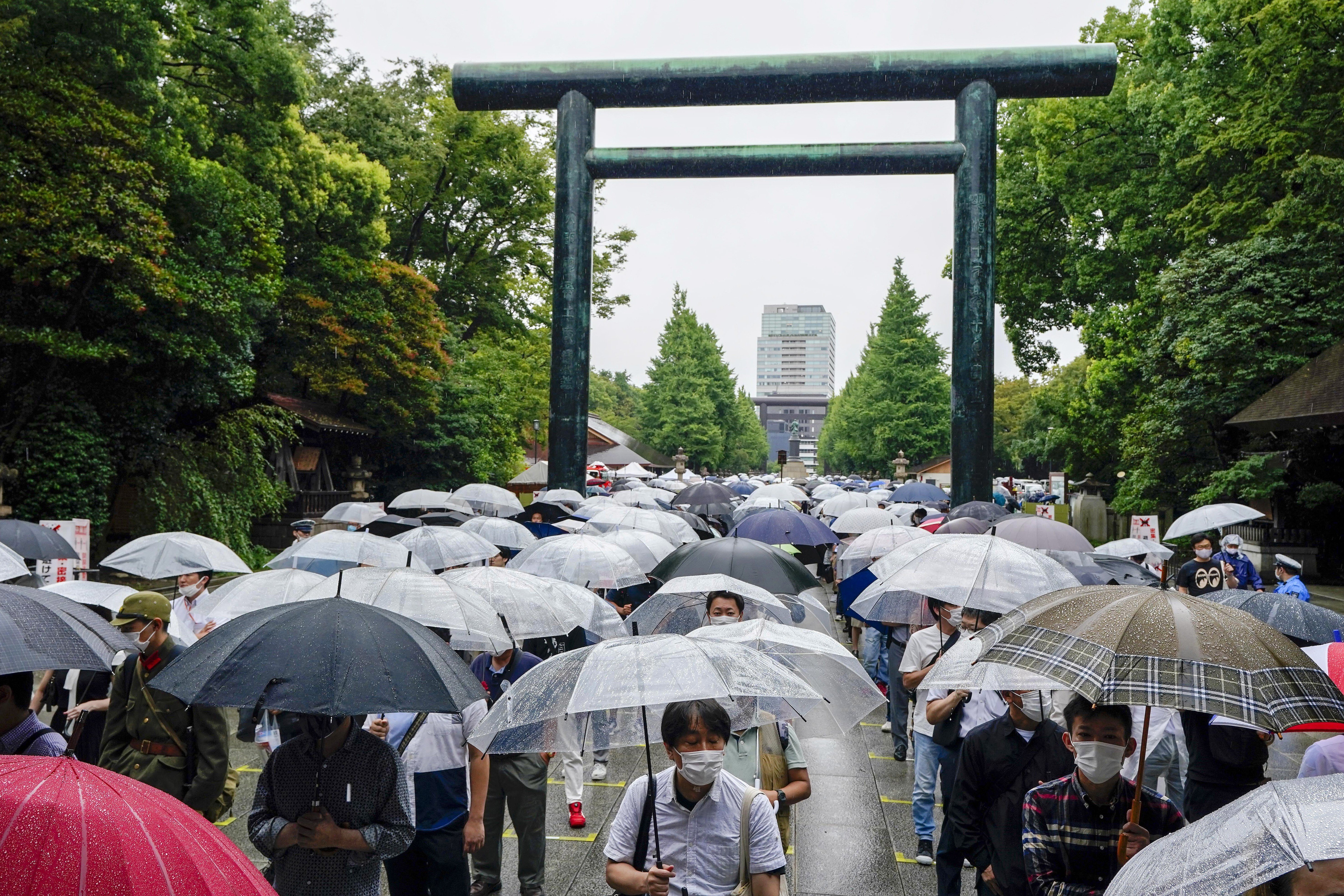 People visit Yasukuni Shrine in Tokyo to pay tribute to the country’s war dead on Sunday, the 76th anniversary of the end of World War II. Photo: EPA-EFE