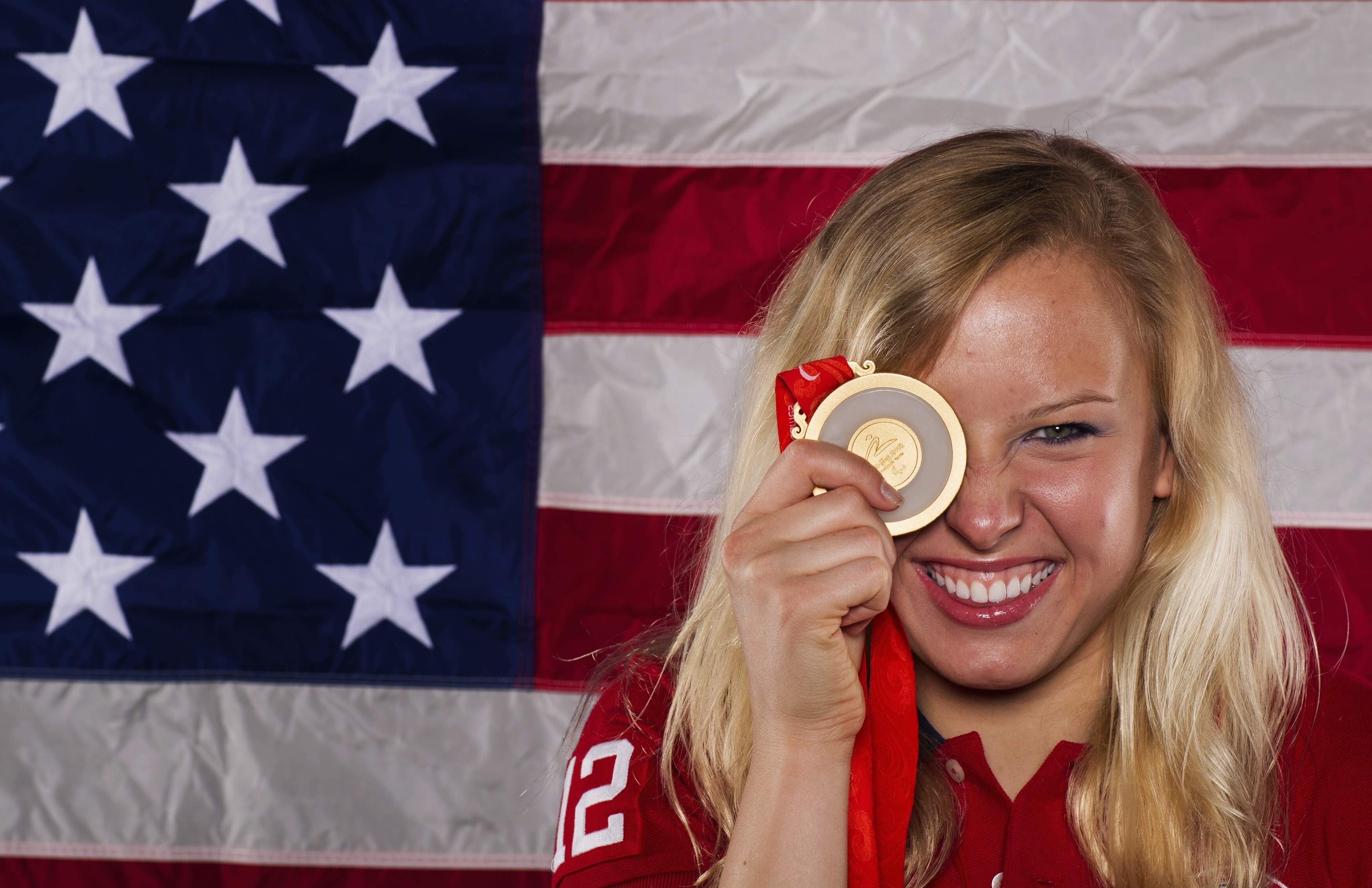 Paralympic swimmer Jessica Long holds up a gold medal as she poses for a portrait during the 2012 US Olympic Team Media Summit. Long is competing in the Tokyo 2020 Paralympic Games. Photo: Reuters