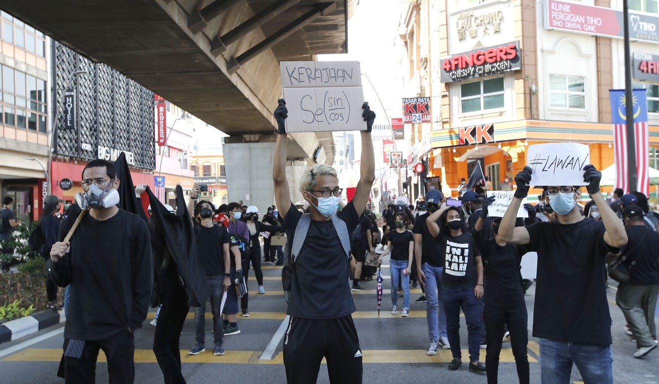 Hundreds of black-clad Malaysian youths rallied in Kuala Lumpur on July 31, demanding the resignation of Prime Minister Muhyiddin Yassin. Photo: AP