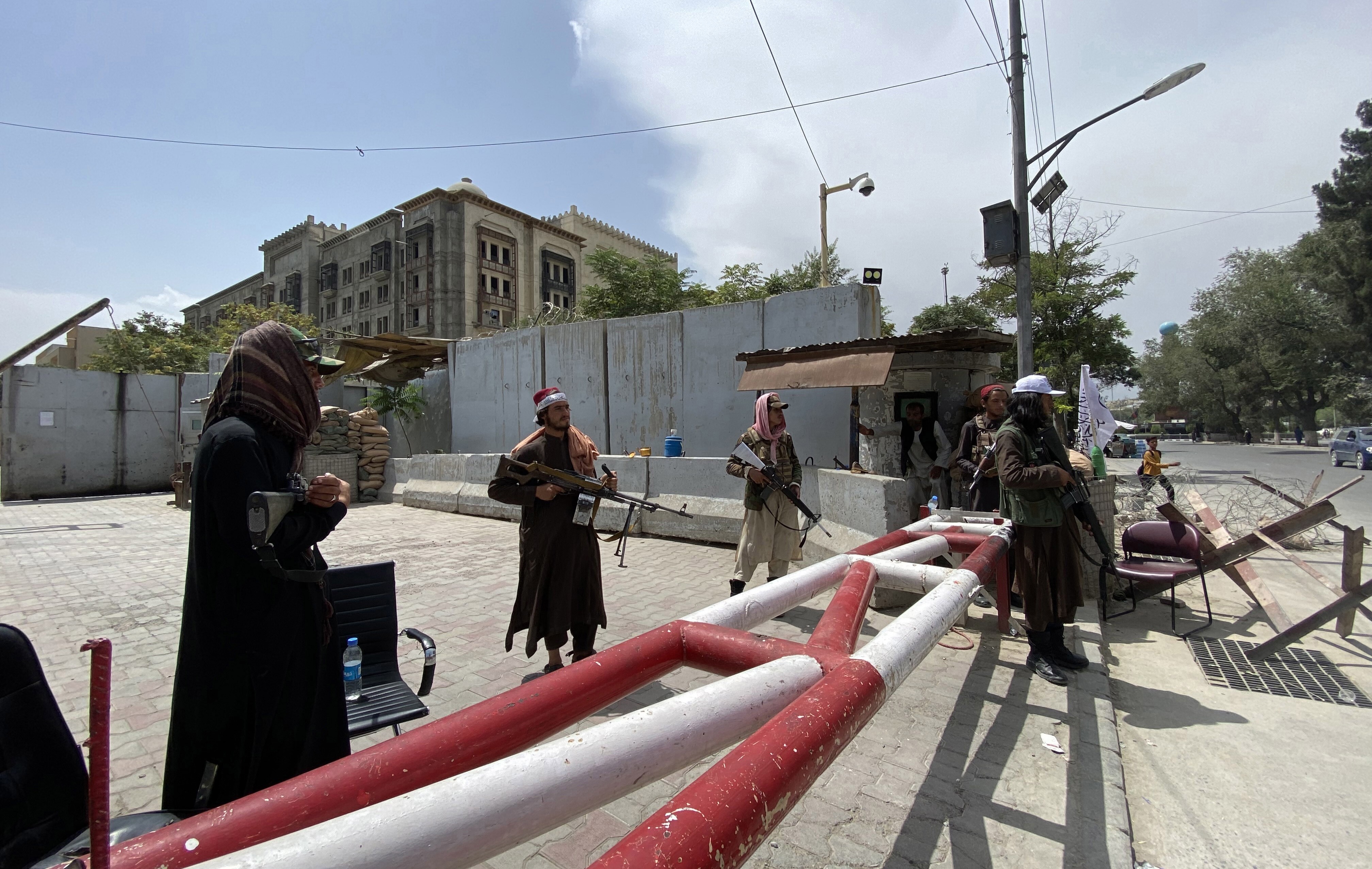 Taliban fighters stand guard on Tuesday outside the Green Zone of Kabul where most embassies are situated, a day after the insurgent group took control of the Afghan capital. Photo: EPA-EFE