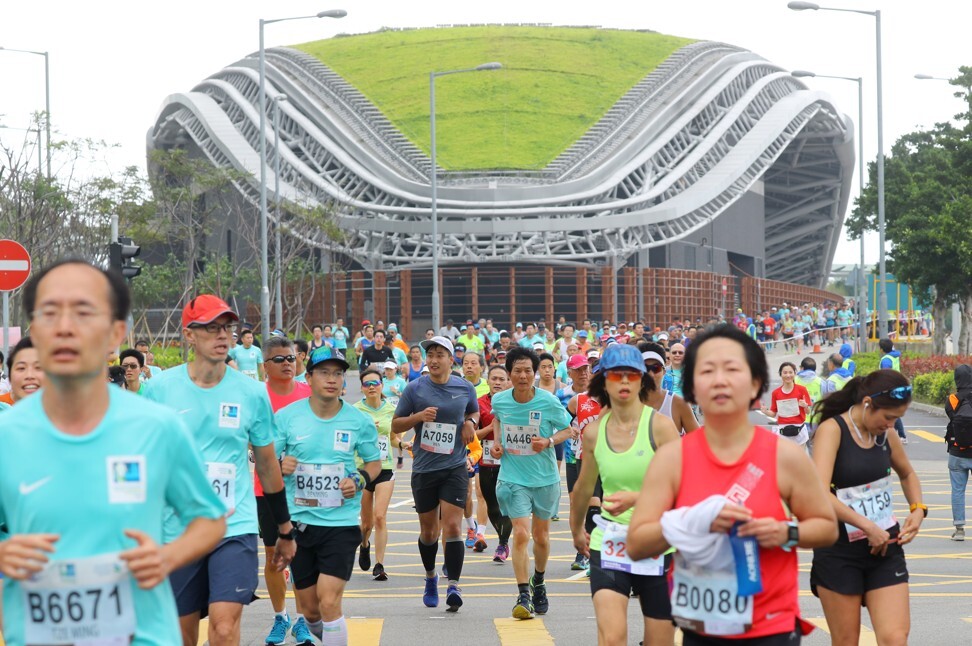 Participants run through Central during the 2019 Standard Chartered Hong Kong Marathon. Photo: SCMP / Edmond So