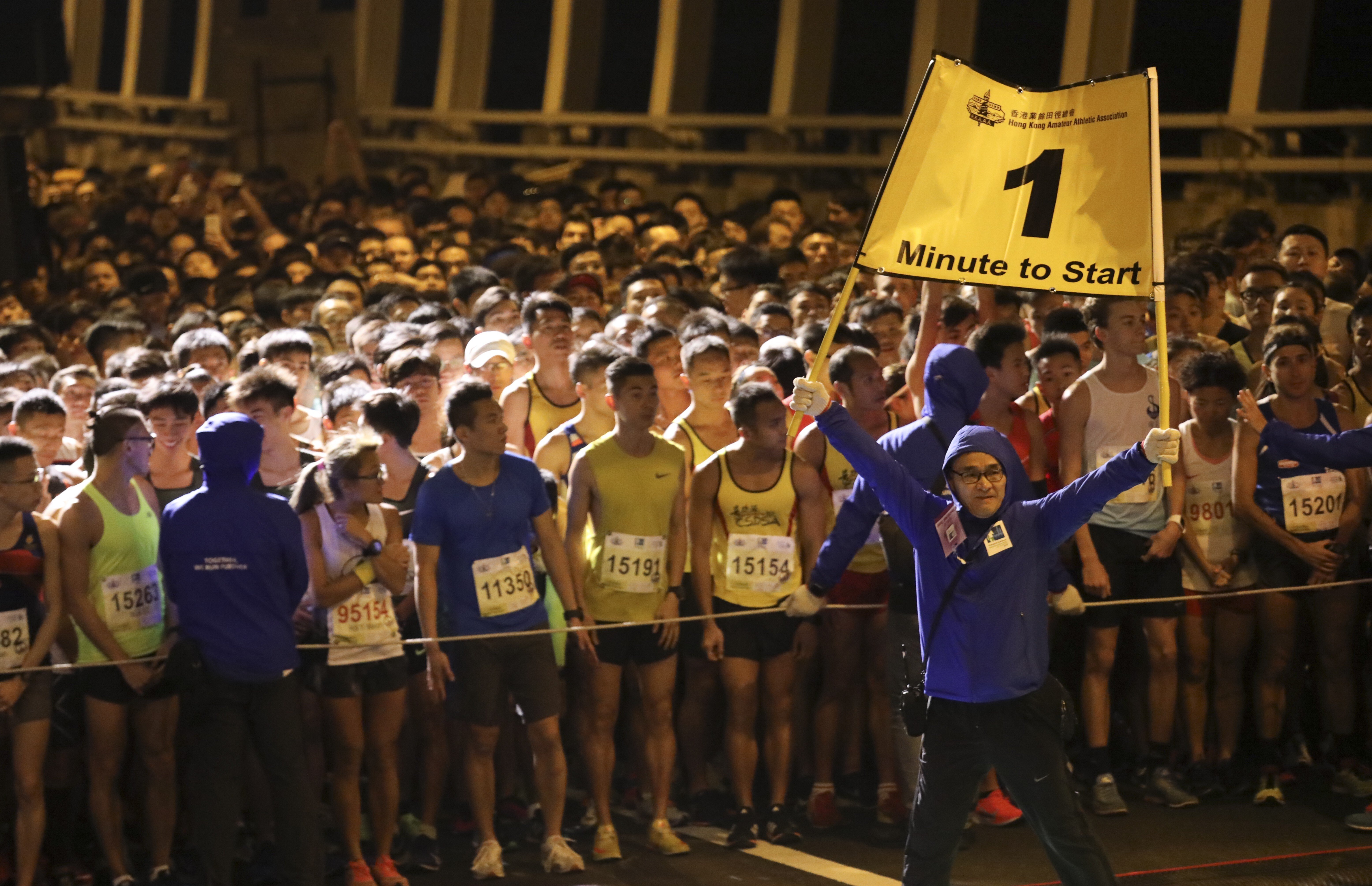 Runners prepare for the start of the 10km Standard Chartered Hong Kong Marathon run in 2019. The event is now set for a return. Photo: SCMP / Felix Wong