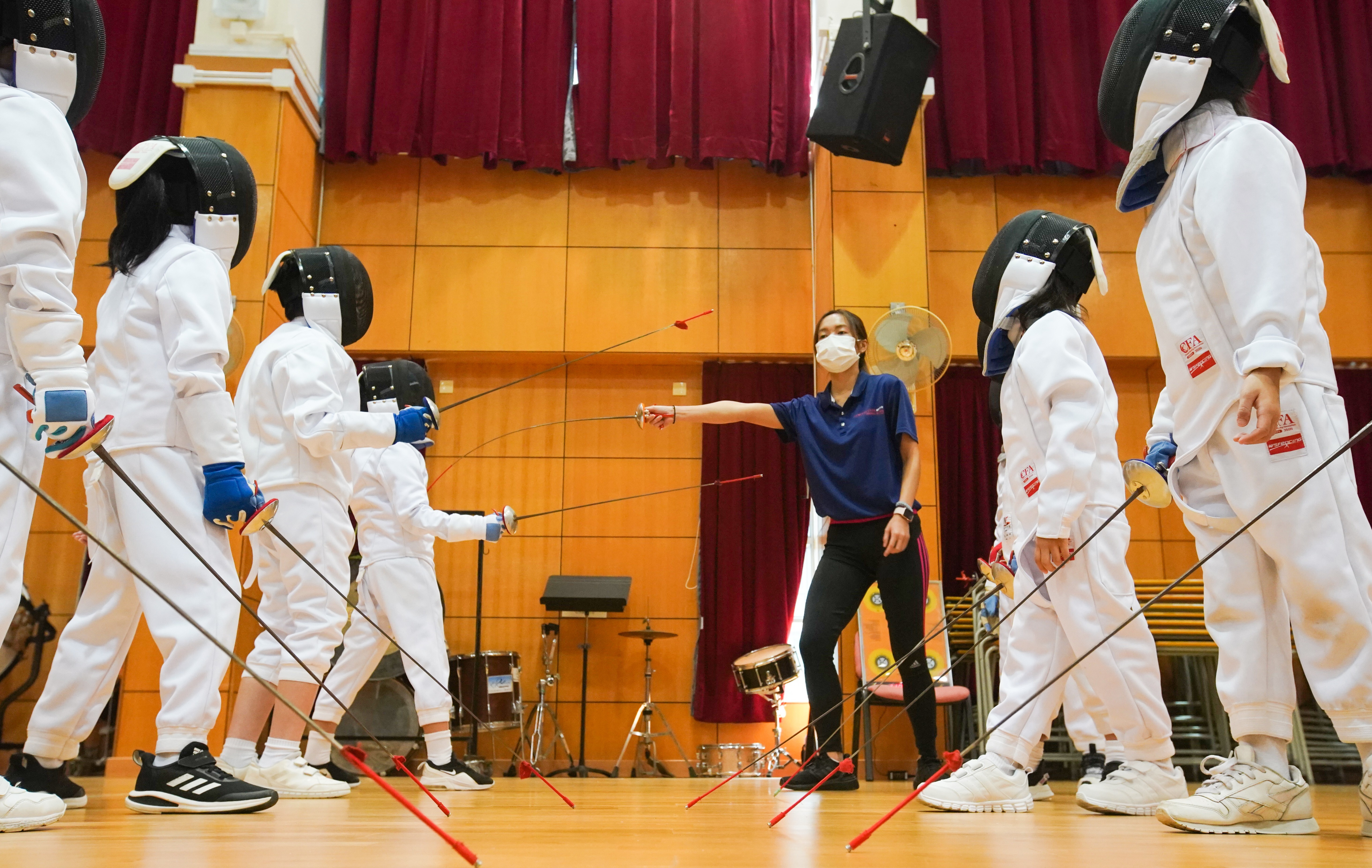 Pupils during a fencing session at Po Leung Kuk Riverain Primary School. Photo: Felix Wong
