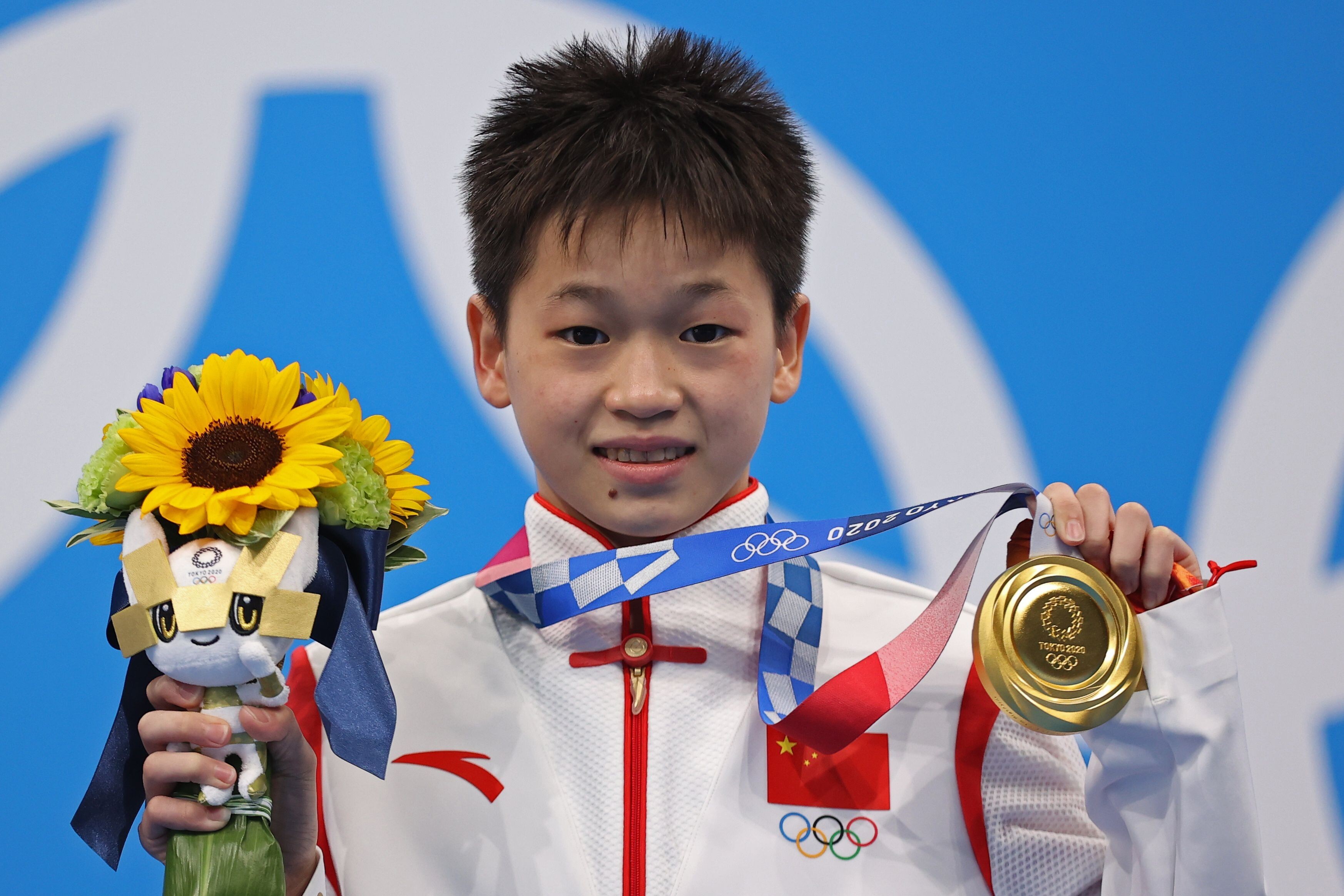 Gold medallist Quan Hongchan of China is just one of a number of athletes who are having their names used illegally to sell a range of products in China. Photo: Reuters.