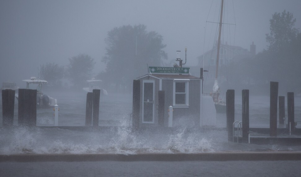 Waves crash around the Dockmaster’s building at the Watch Hill Yacht Club as Tropical Storm Henri arrives in Westerly, Rhode Island on Sunday. Photo: EPA-EFE