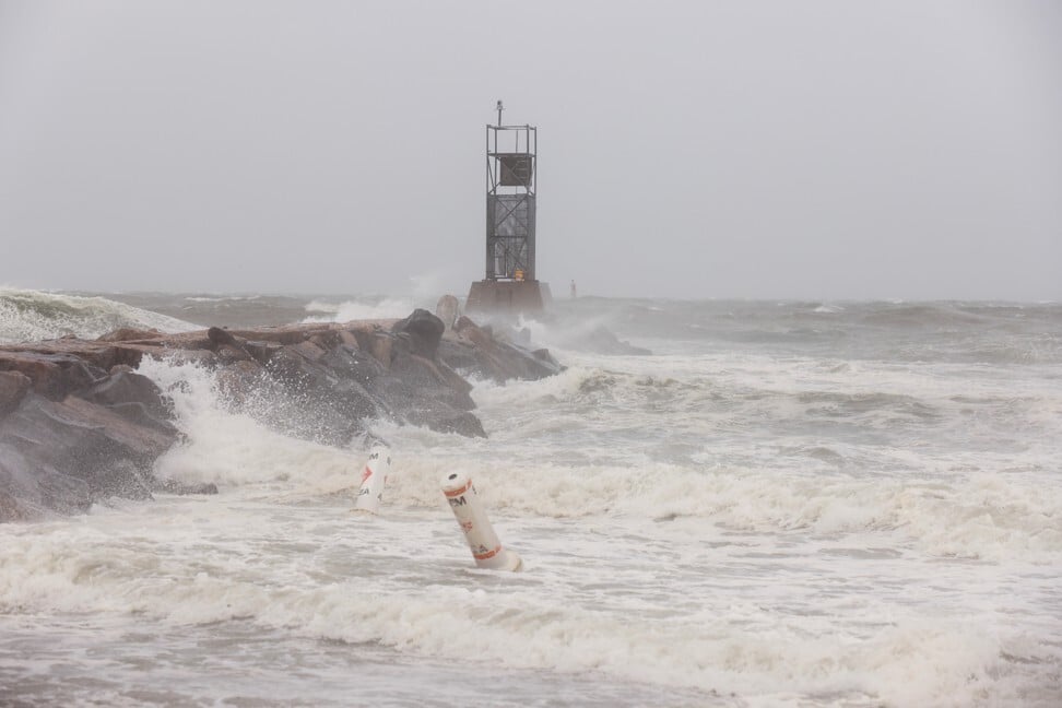 Waves crash on rocks during Tropical Storm Henri in Montauk, New York on Sunday. Photo: Reuters