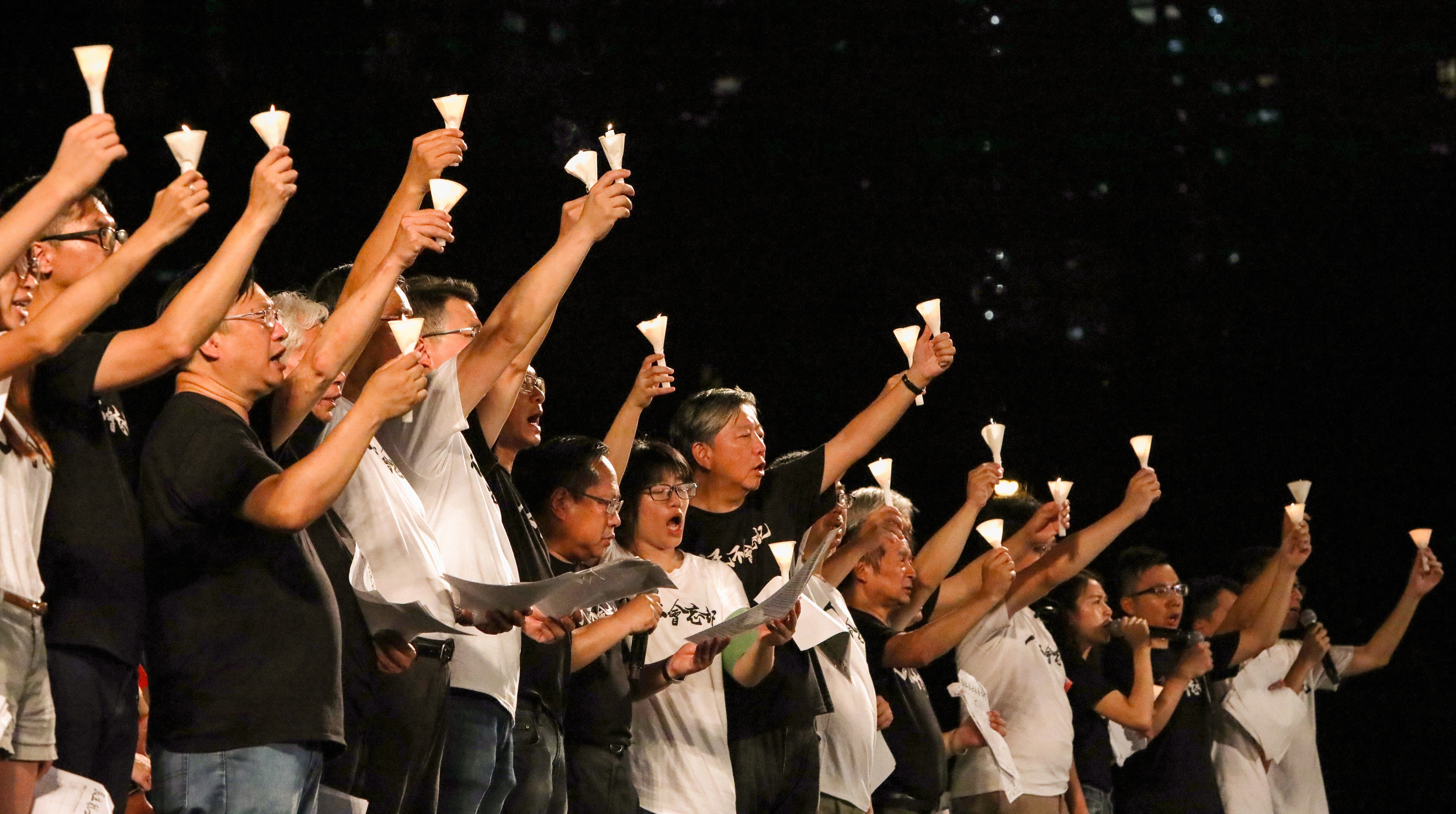 Members of the Hong Kong Alliance in Support of Patriotic Democratic Movements of China raise candles at a 2019 vigil marking the anniversary of the Tiananmen Square crackdown. Photo: Felix Wong