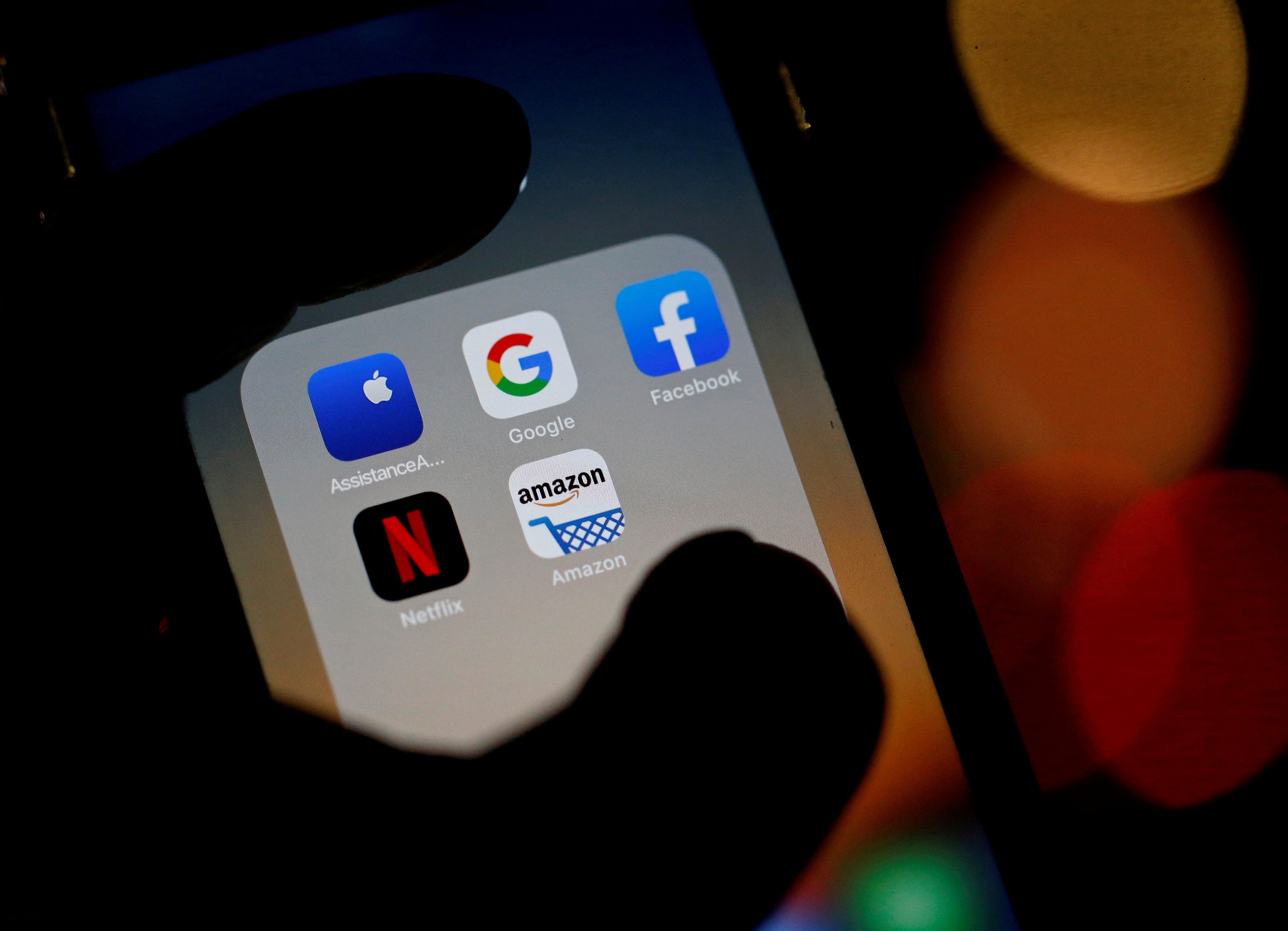 Logos of mobile apps Google, Amazon, Facebook, Apple and Netflix. Photo: Reuters