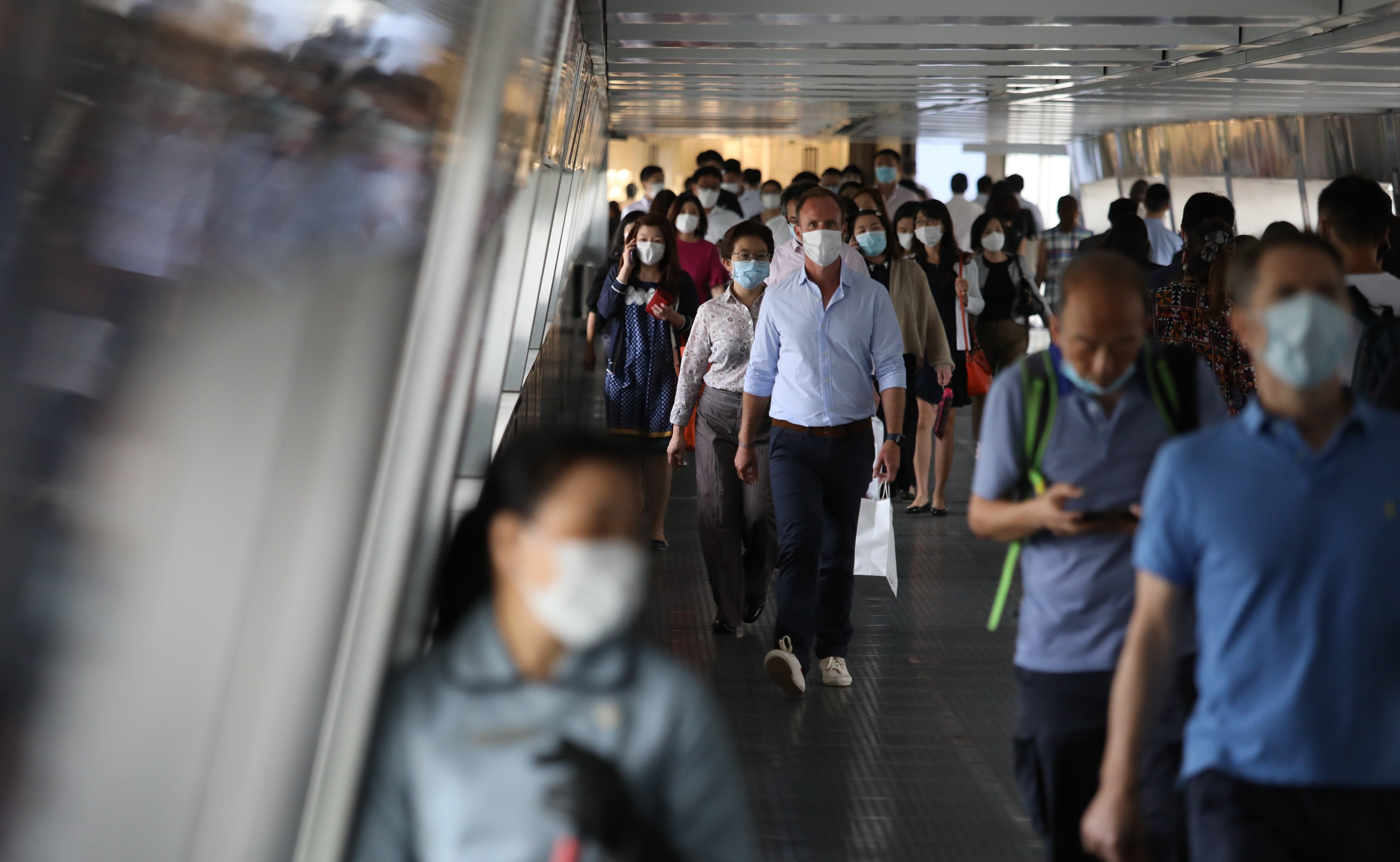 Pedestrians at a footbridge in Central on 19 May 2020. Photo: Nora Tam