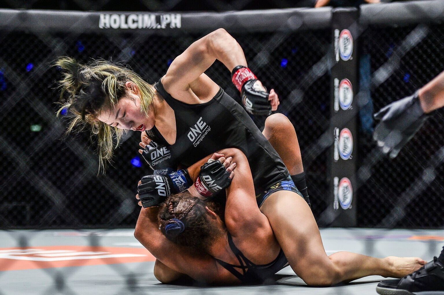 Meng Bo delivers ground and pound to Samara Santos. Photos: ONE Championship