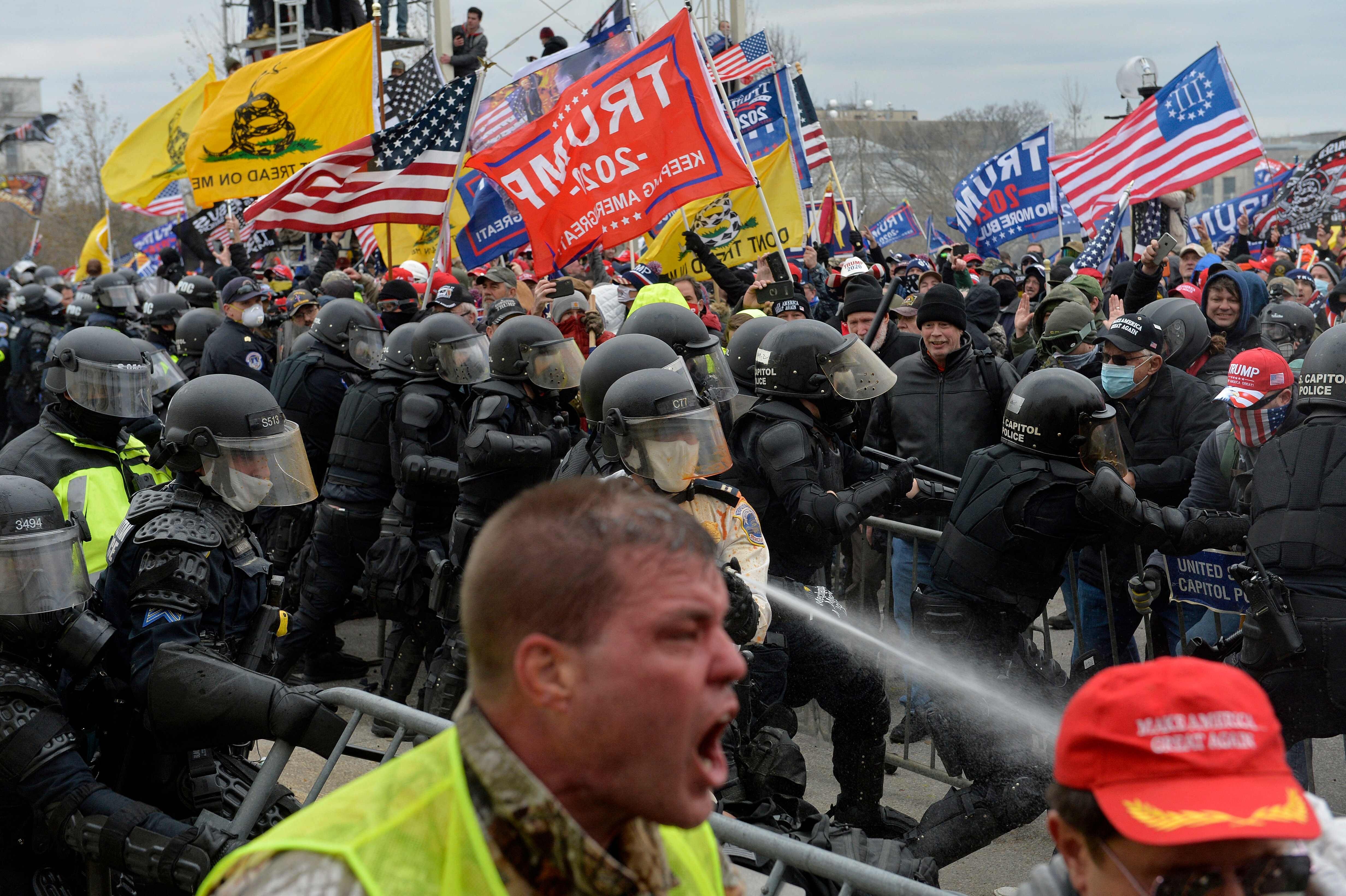 Trump supporters clash with police and security forces as people try to storm the US Capitol in Washington DC on January 6. Photo: AFP