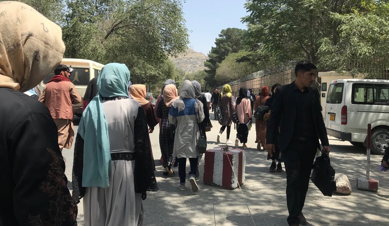 People are seen outside Kabul University the day before the Taliban takeover of the Afghan capital. Many students are now being targeted. Photo: Sonia Sarkar