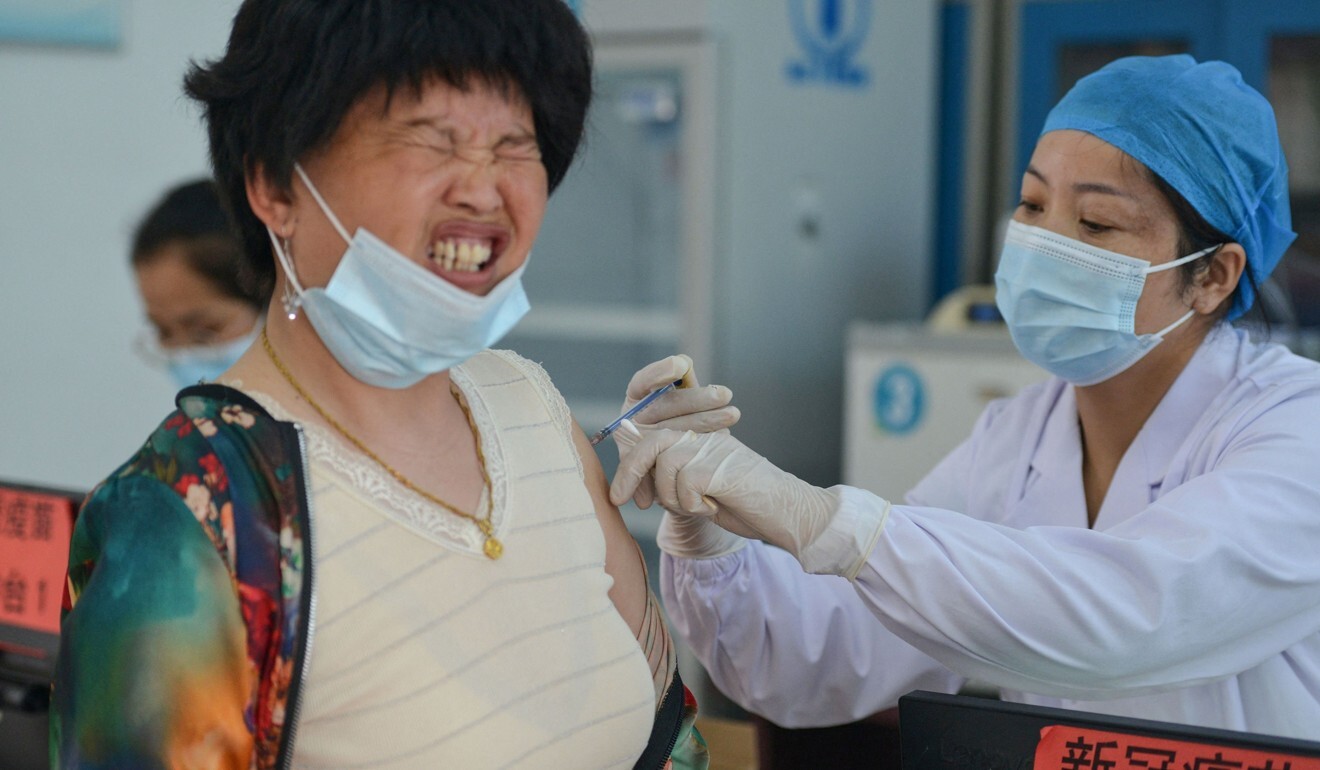 A resident receives the Anhui Zhifei Longcom Covid-19 coronavirus vaccine in Linquan county in Anhui province. Photo: STR / AFP