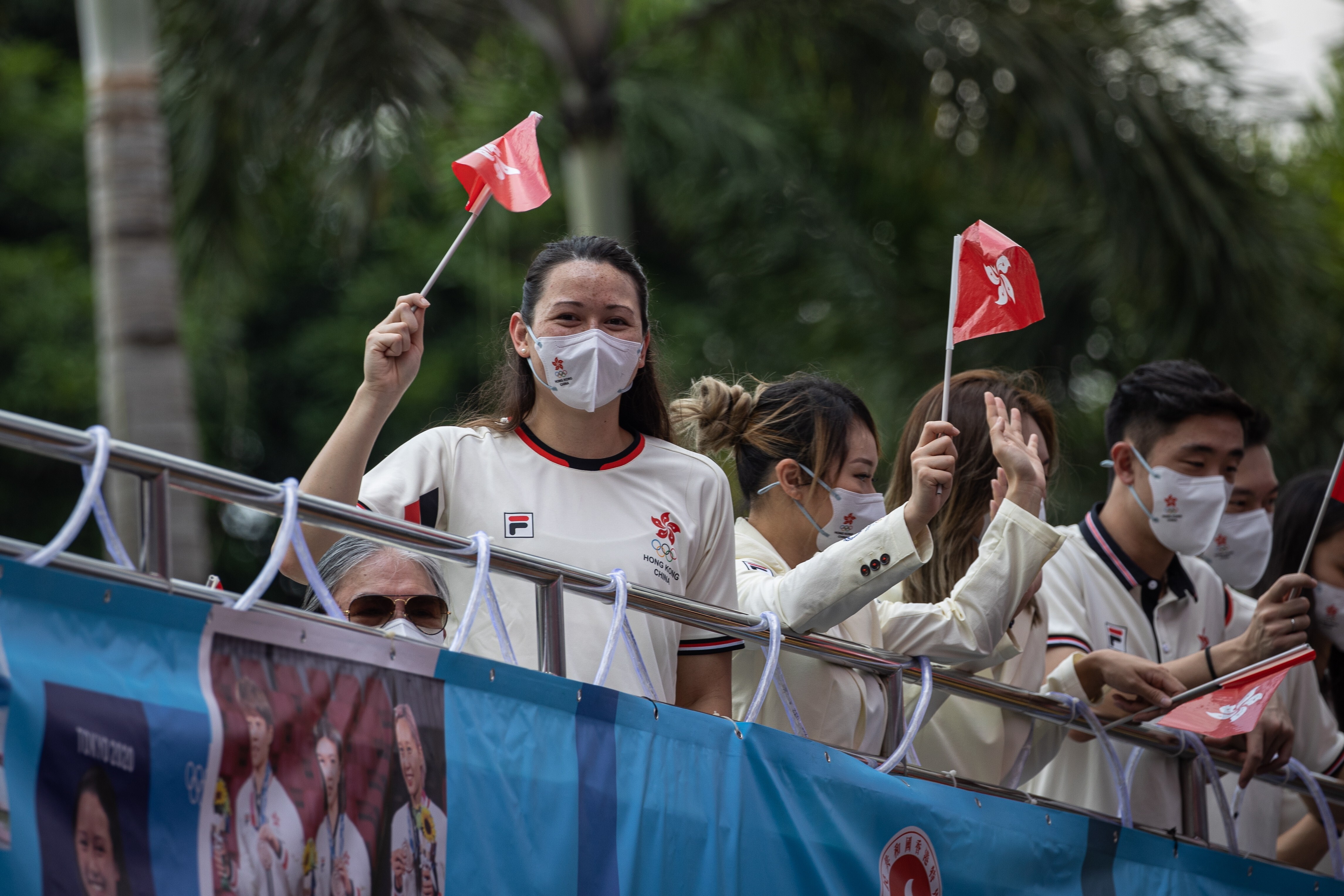 Hong Kong silver medallist swimmer Siobhan Haughey and other Tokyo 2020 Olympic Games athletes on a bus parade in Hong Kong in August. Photo: EPA