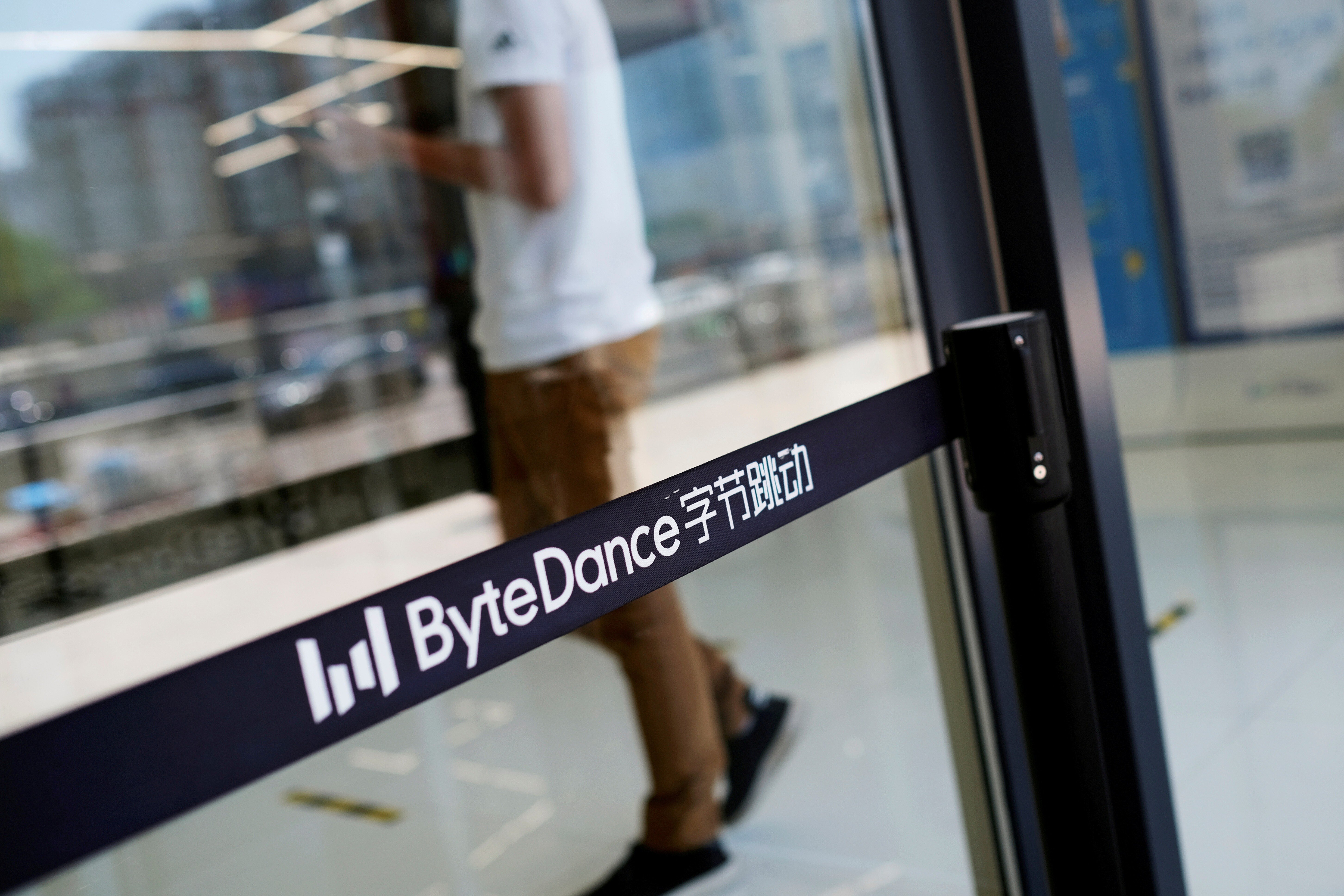 A man walks by a logo of ByteDance at its office in Beijing, China July 7, 2020. Photo: Reuters