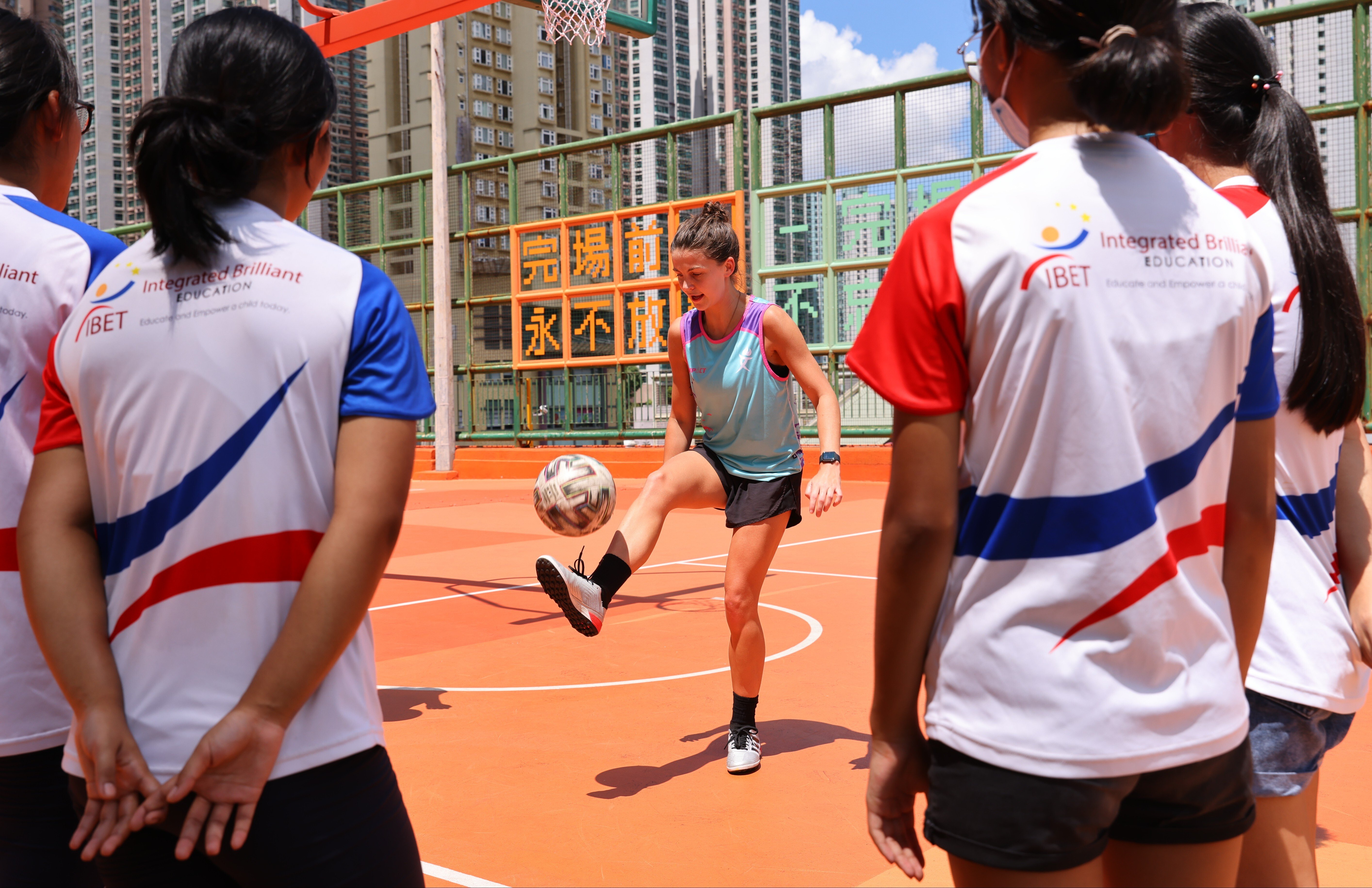 WISE HK (Women In Sport Empowered Hong Kong) coach and footballer for MLFA, Cecily Radford, teaching students from the Integrated Brilliant Education Limited (IBEL) school in Tseung Kwan O, Hong Kong. Photo: SCMP/ Dickson Lee