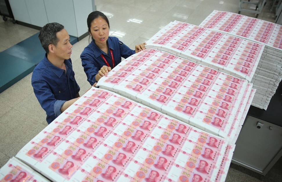 Workers checking renminbi notes at a factory in Shijiazhuang of the China Banknote Printing and Minting Corporation on 20 May 2020. Photo: Imaginechina.