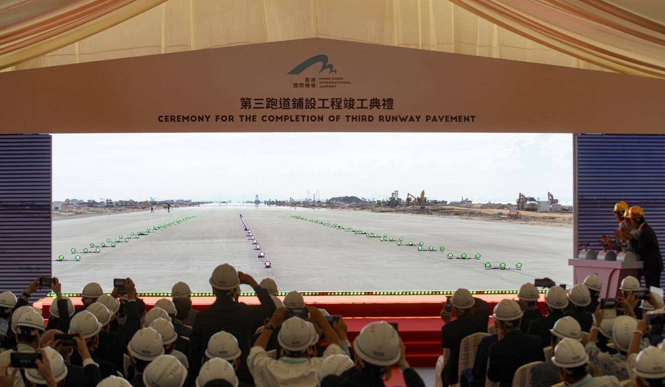 Officials and media during a visit to the site of the third runway. Photo: Winson Wong