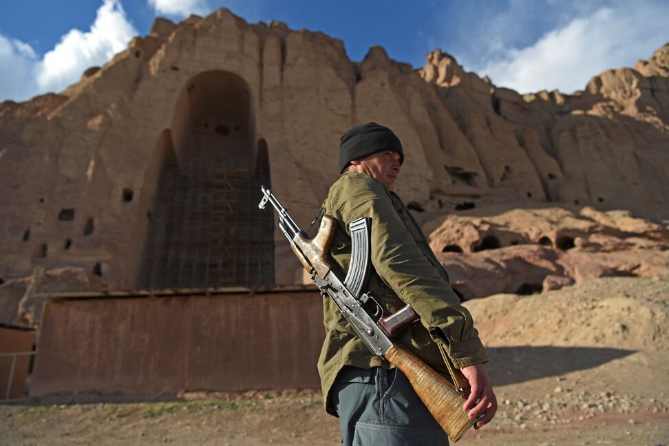 A policeman patrols the site where the statues of Buddha stood in Bamiyan before being destroyed by the Taliban in March 2001. Photo: AFP