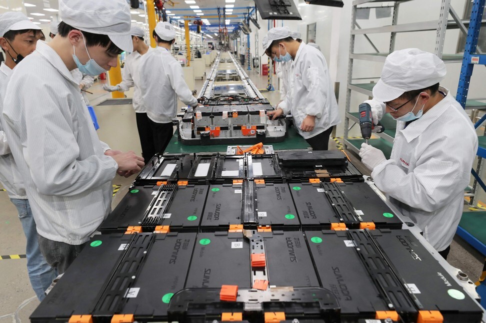 Workers at Xinwangda Electric Vehicle Battery Co.’s factory in the Jiangsu provincial capital of Nanjing, on March 12, 2021. Photo: AFP.