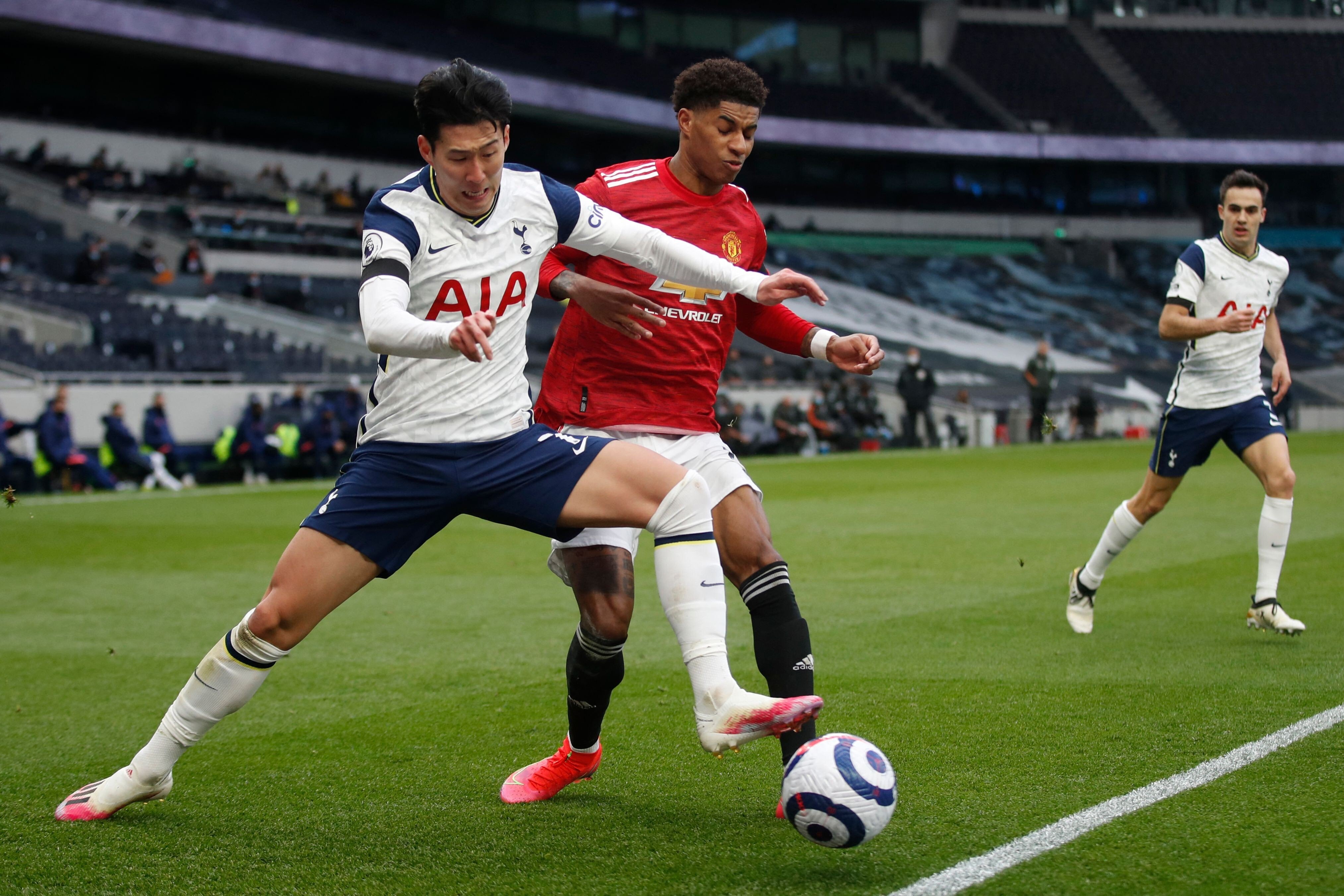 Tottenham Hotspur's South Korean striker Son Heung-min fights for the ball with Manchester United's English forward Marcus Rashford during an English Premier League match at the Tottenham Hotspur Stadium in April, 2021. Photo: AFP