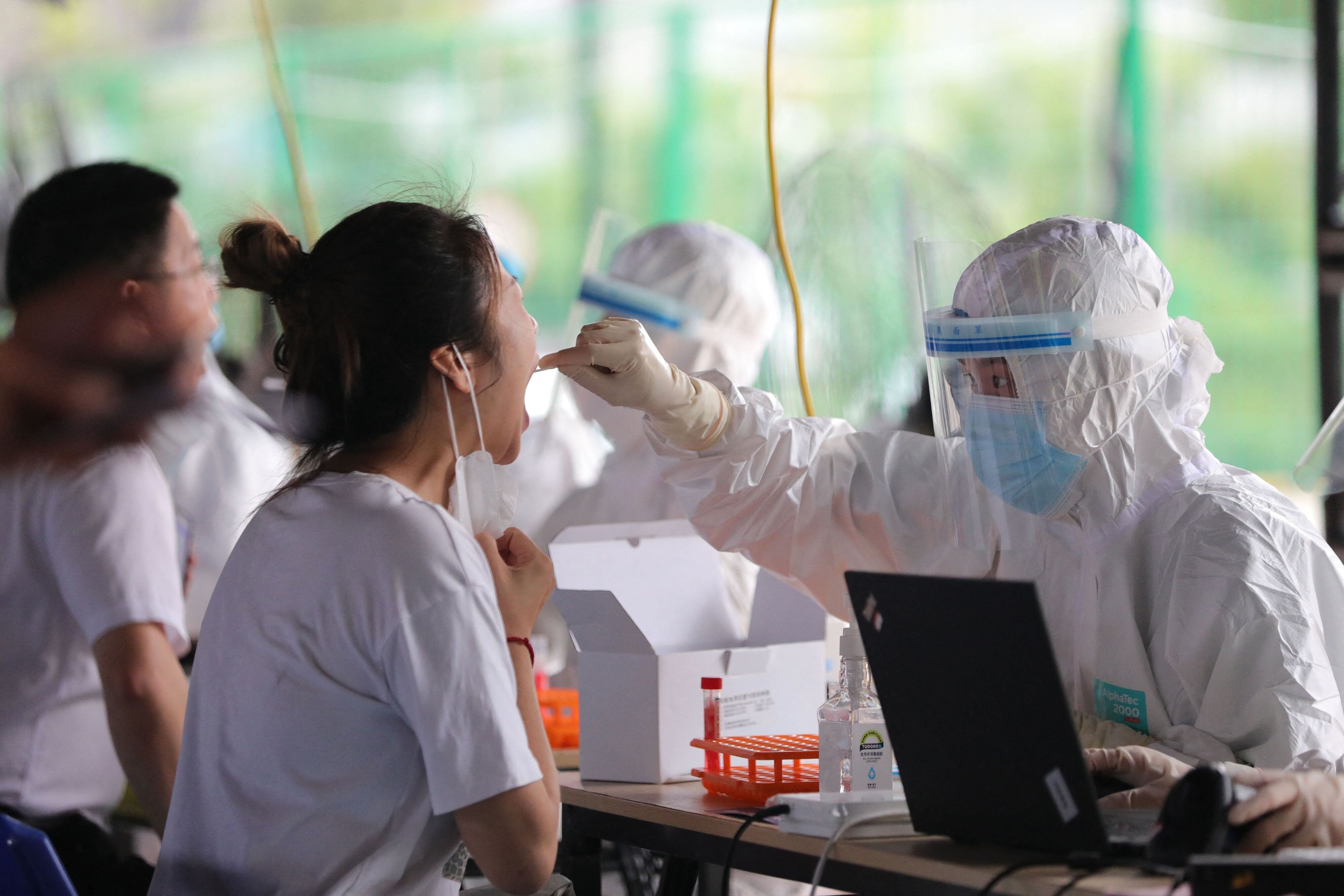 Nucleic acid testing for Covid-19 under way on Saturday in Xiamen, Fujian province. The city reported 39 new locally transmitted cases. Photo: AFP