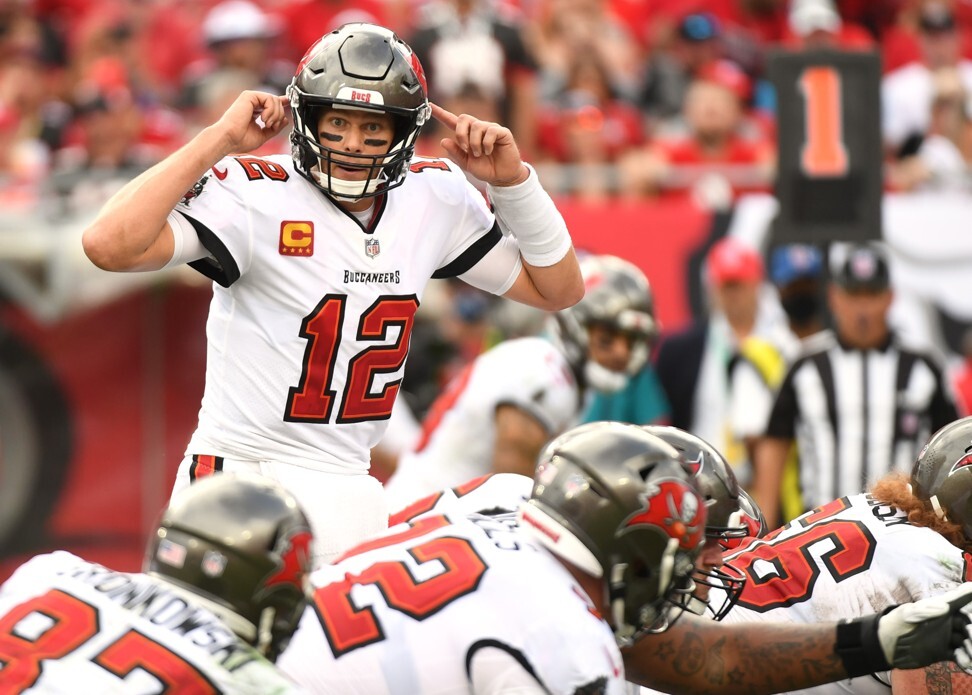 Tampa Bay Buccaneers quarterback Tom Brady signals for a touchdown