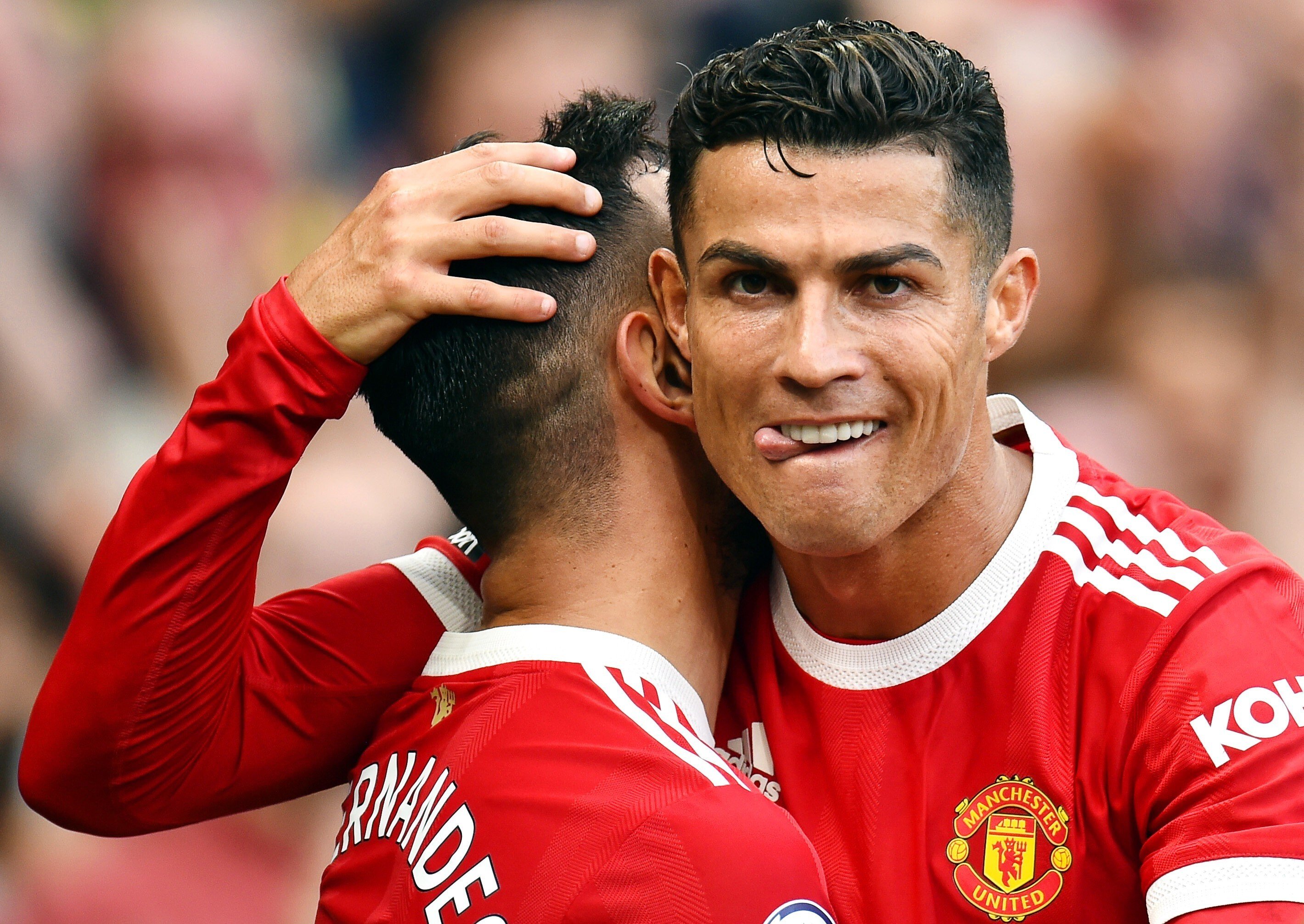 Cristiano Ronaldo congratulates Manchester United teammate Bruno Fernandes after a goal against Newcastle United in the English Premier League. Photo: EPA